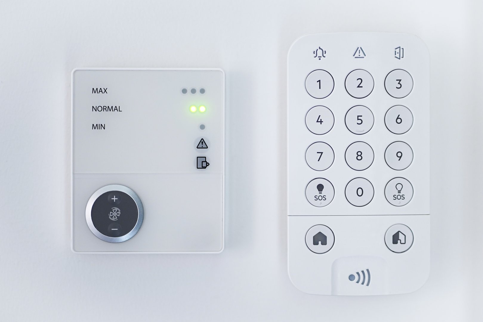 Image of Home security panel keypad and air conditioning panel