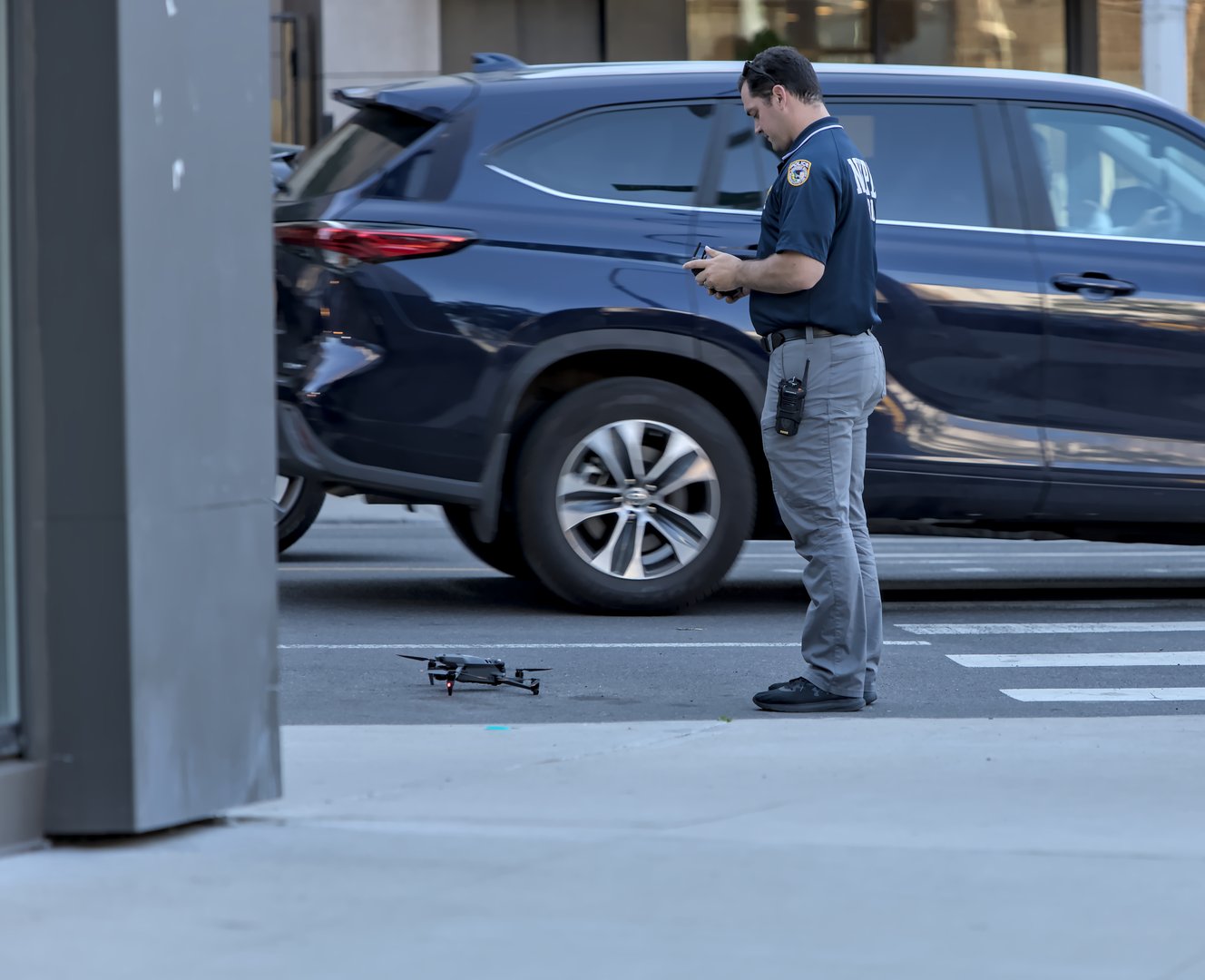 Brooklyn, NY - May 31 2024: NYPD officer flies drone in Brooklyn, New York City.