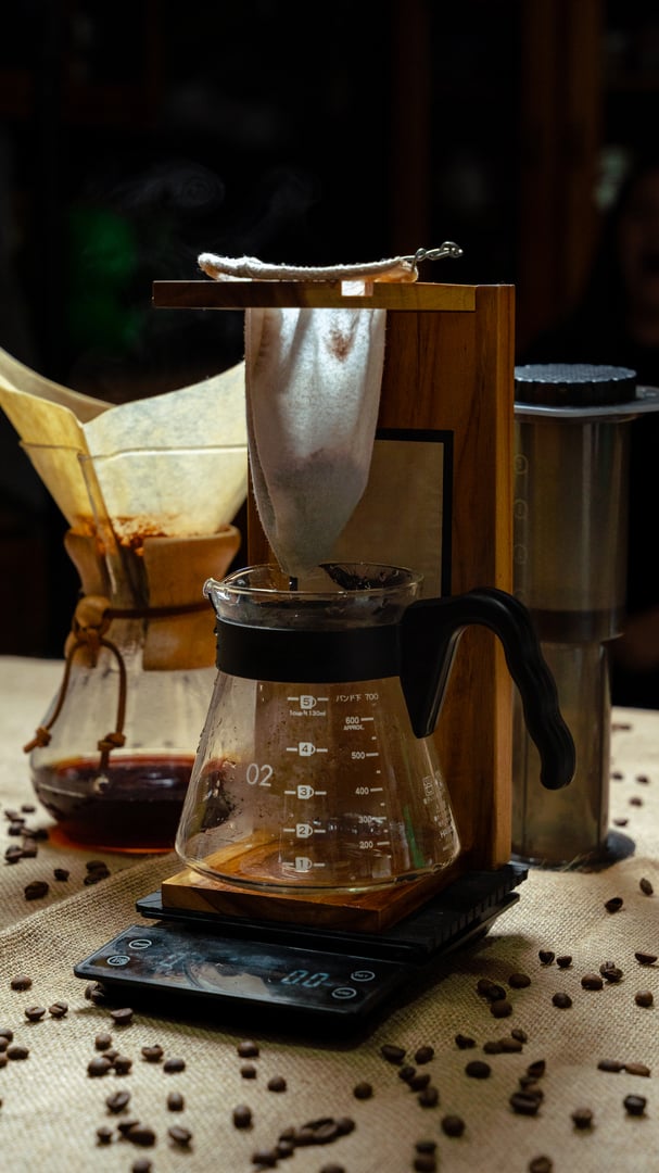 Coffee dripping into a glass carafe during the pour-over brewing process
