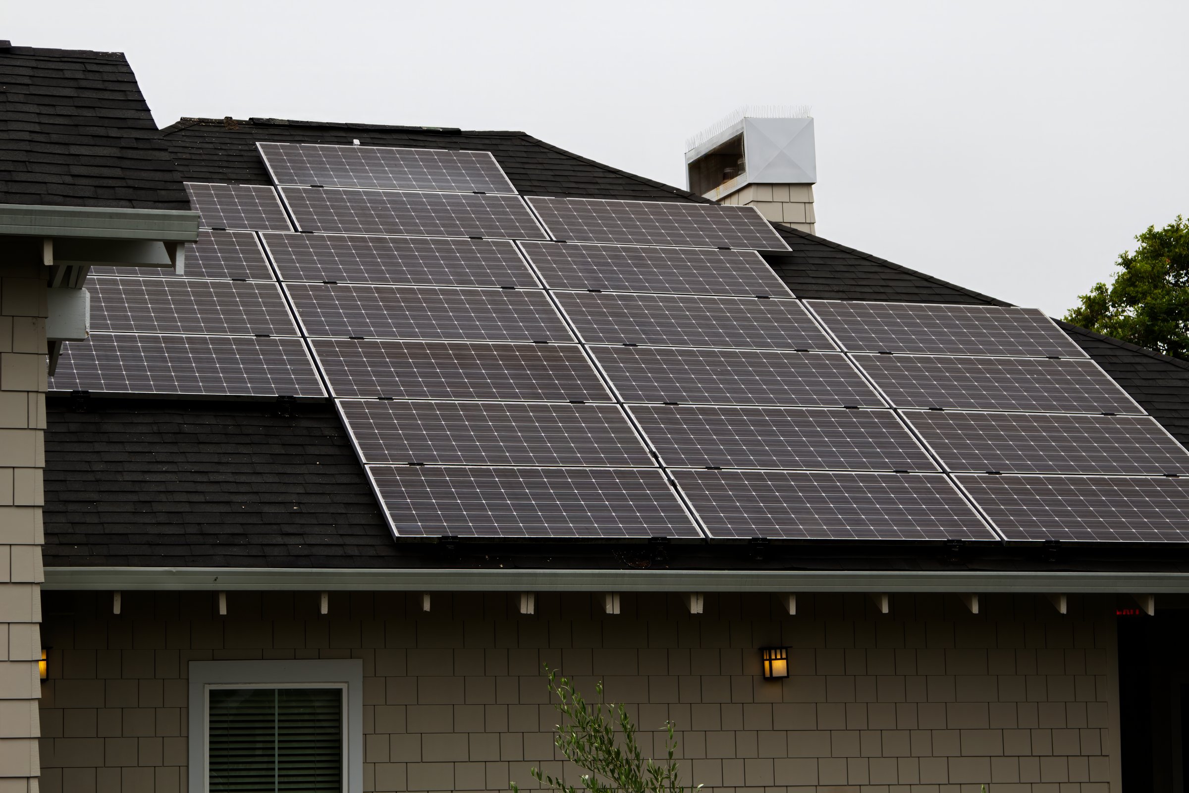 Solar Panels Covering Roof Of Resort Hotel With Overcast Sky California
