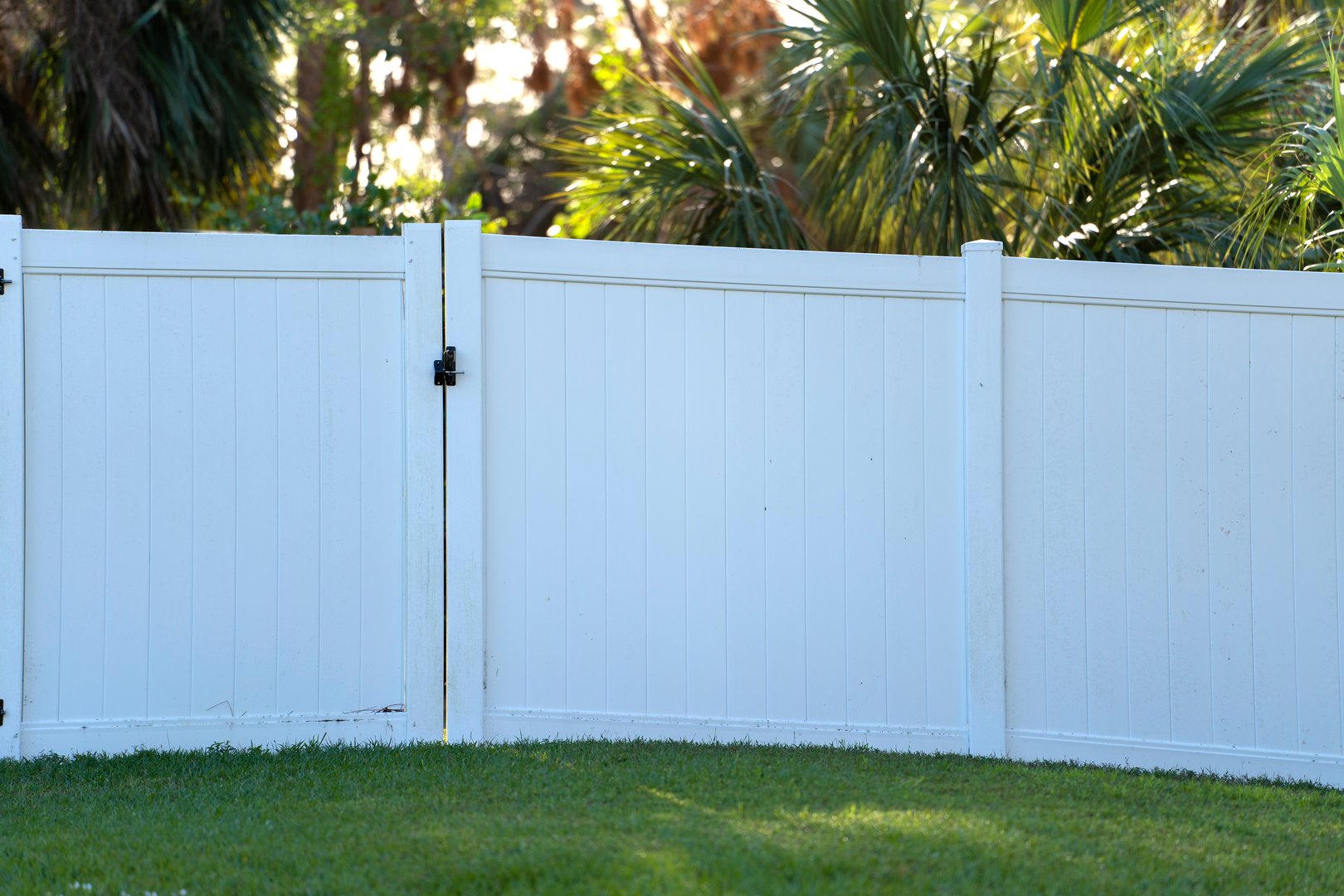 White vinyl picket fence