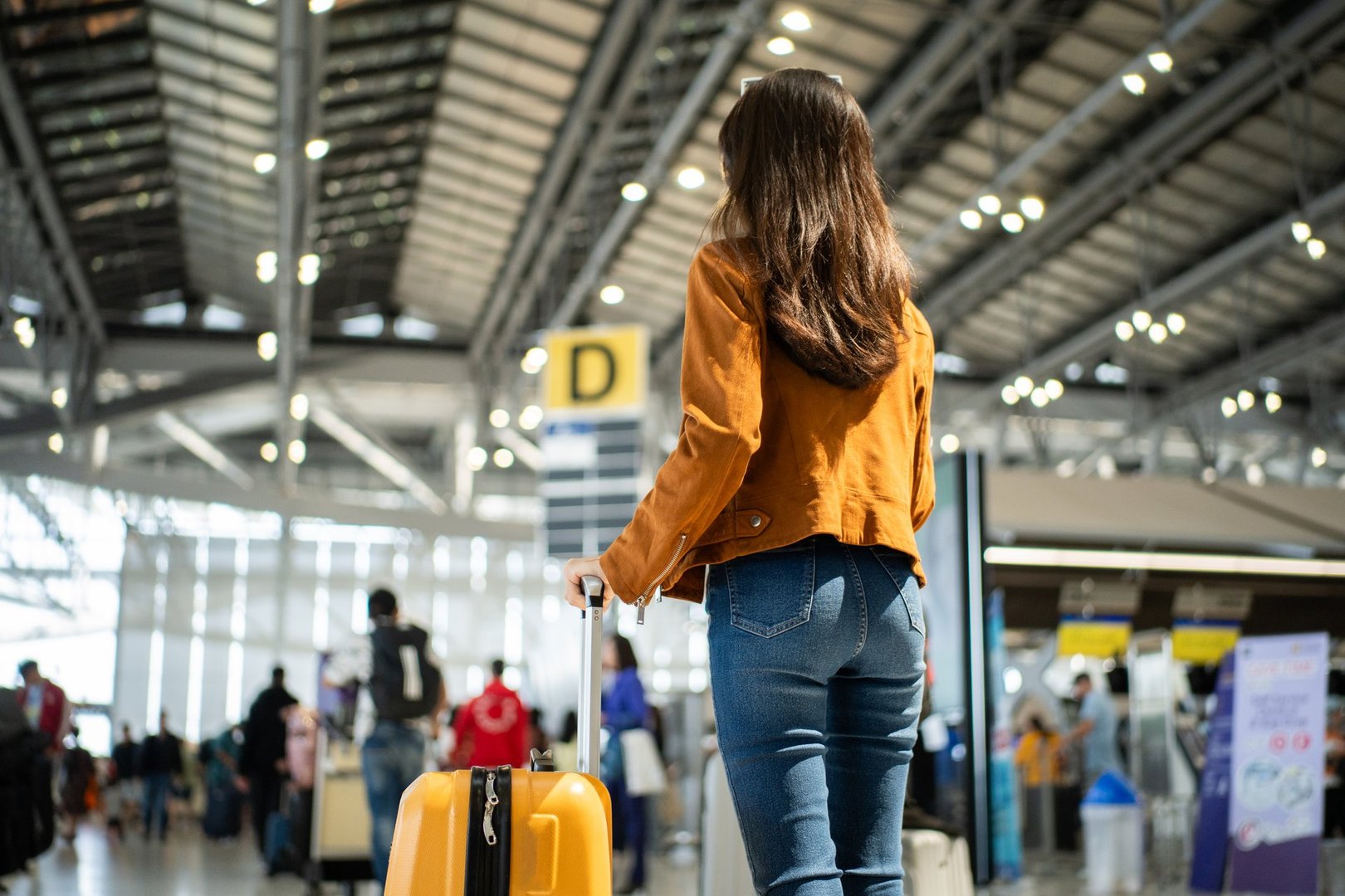 Airport passenger arriving with luggage