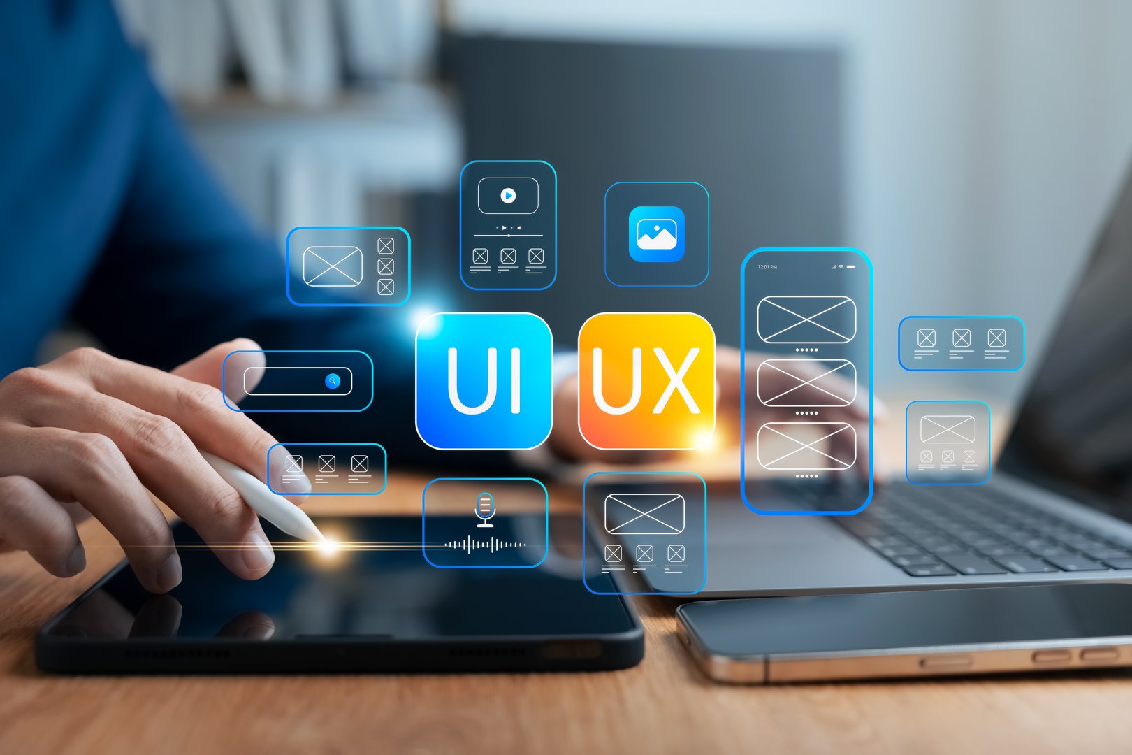UI/UX design concept showing wireframe interface development on tablet using stylus