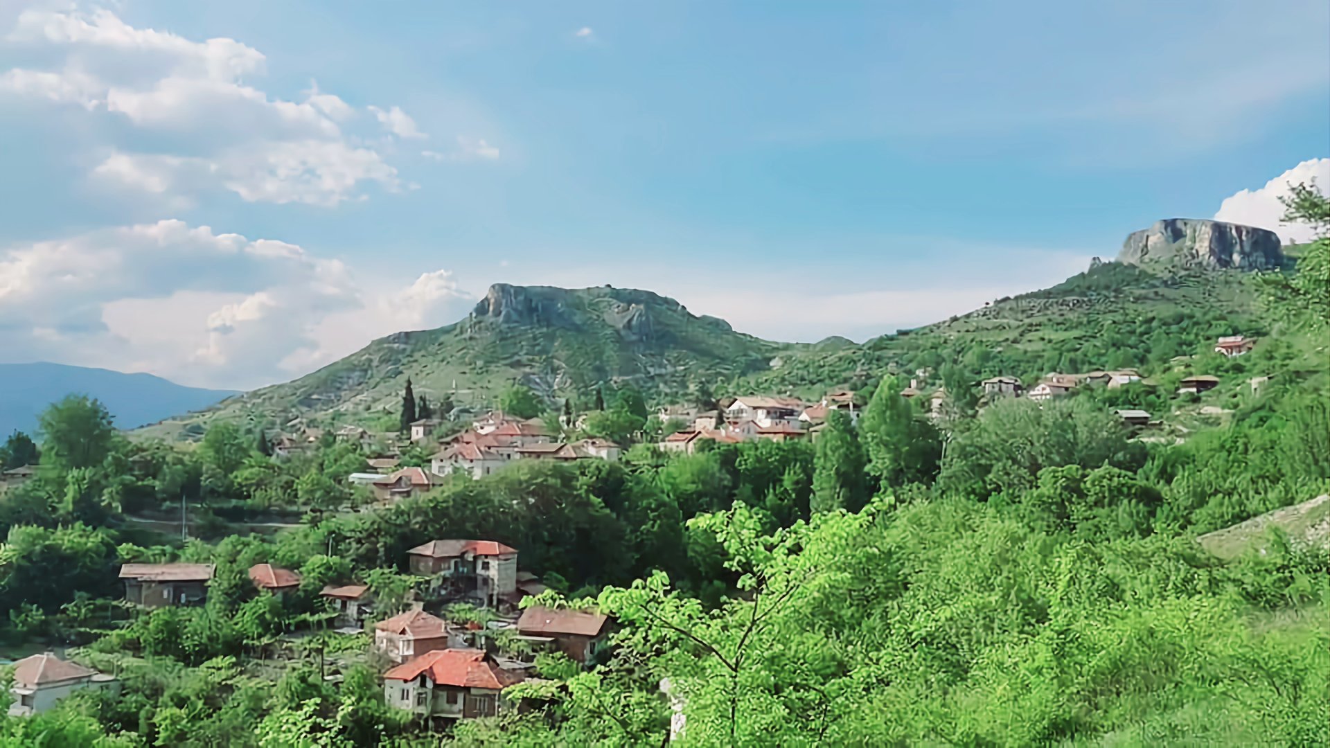 Bulgarian language immersion experience in Struma Valley vineyards with authentic mountain landscape