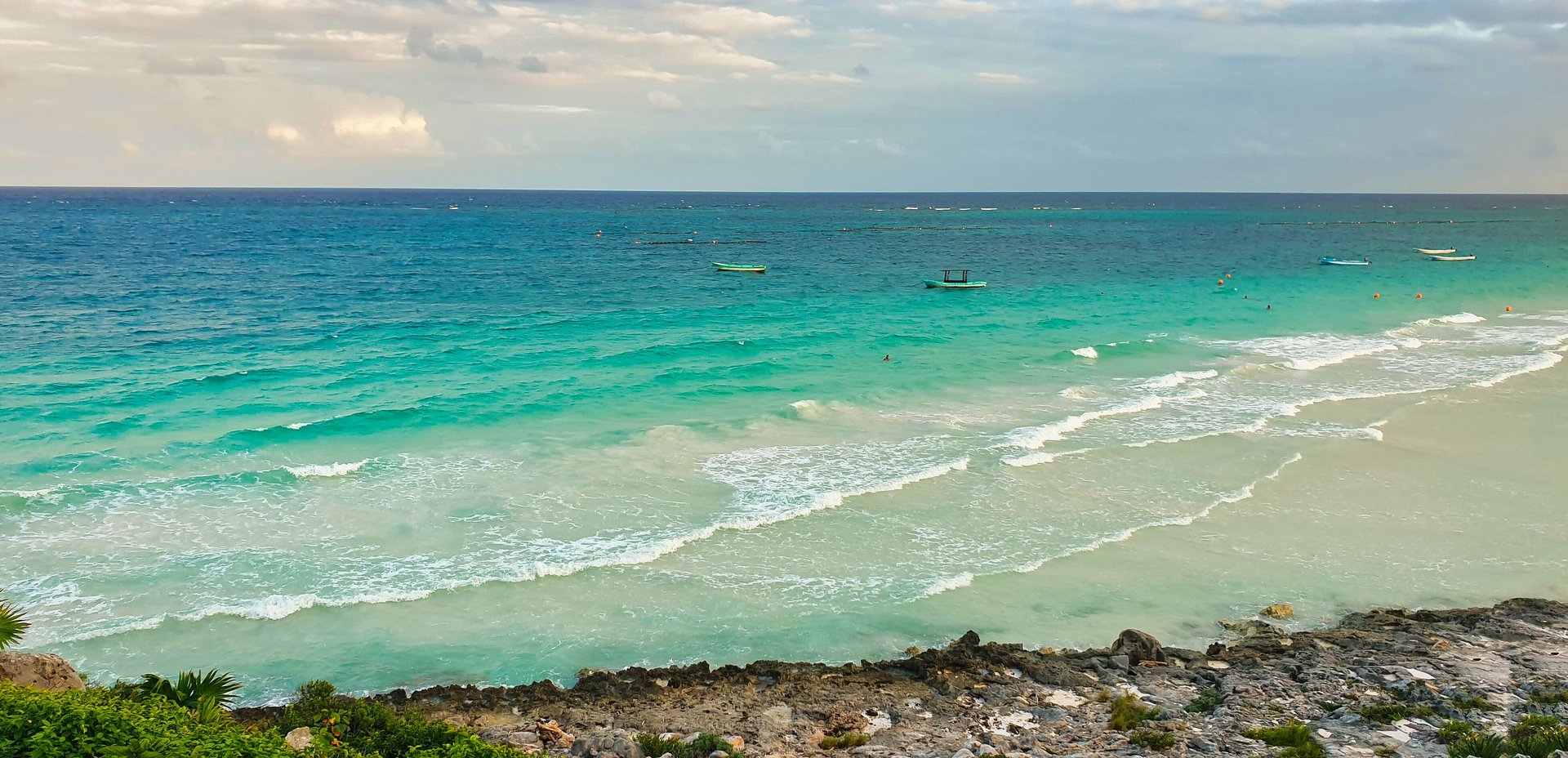 Azure and turquoise blue green waters of the Caribbean sea off the coast of the late 13th century Mayan ruins of Tulum,Mexico