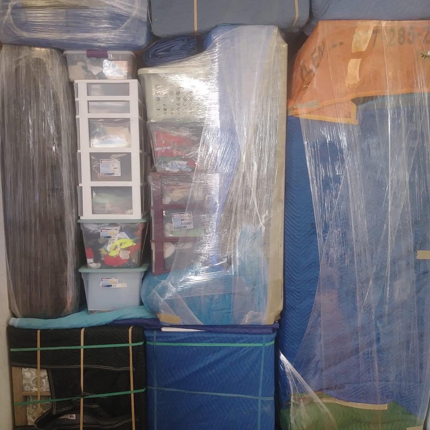 Moving Marvels packed boxes labeled with books and clothes