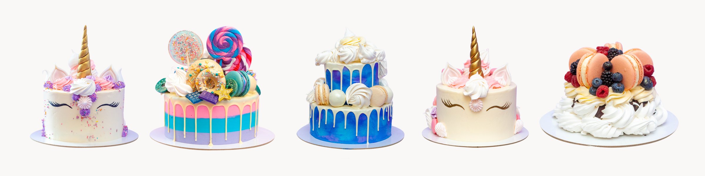 Assorted mini cupcakes on a cake stand against a pink background