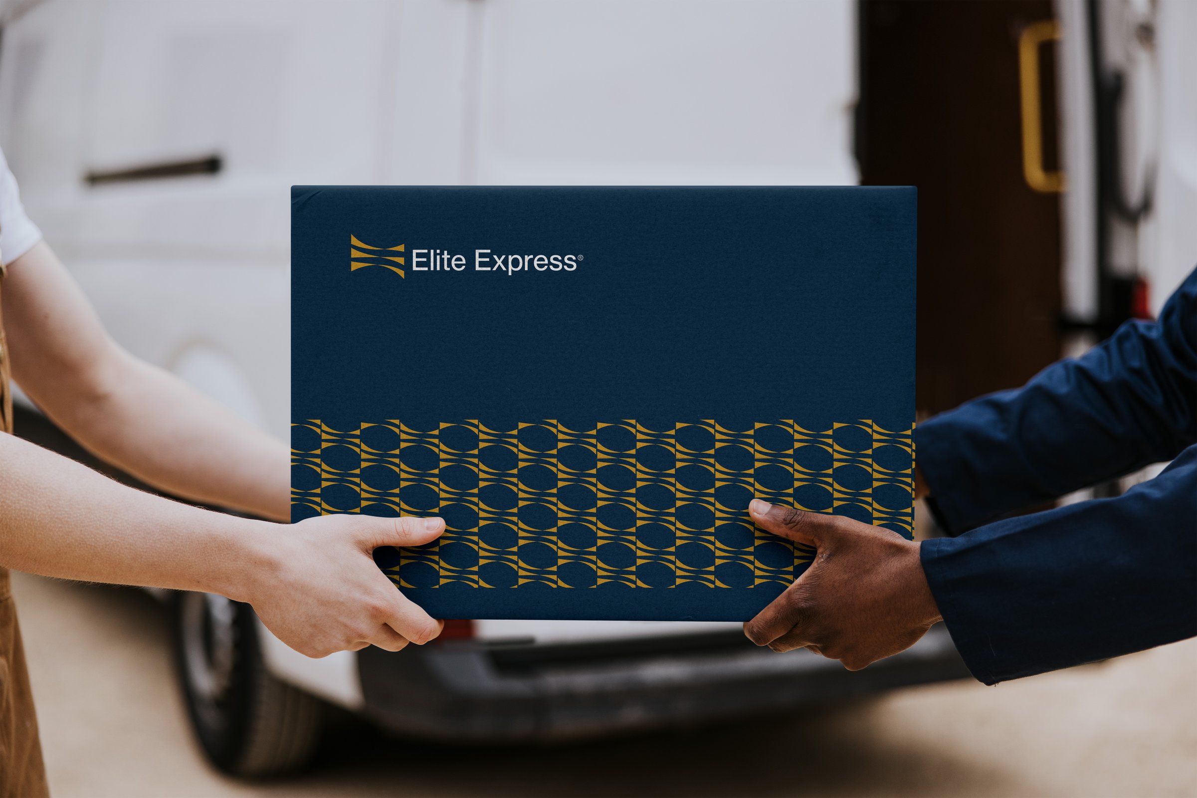 Two people exchanging a branded parcel with "Elite Express" logo in front of a delivery van.