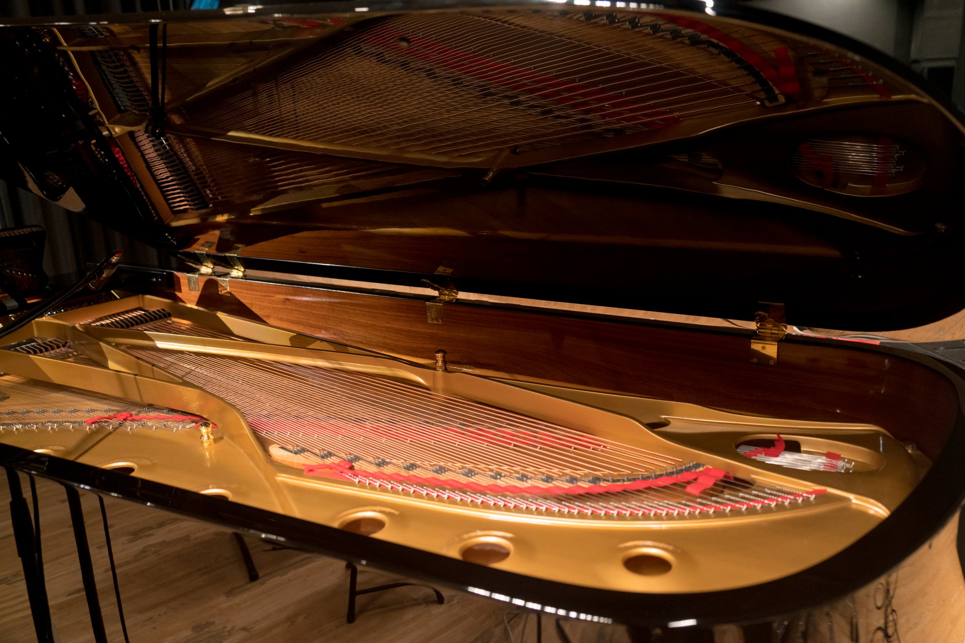 A grand piano set up on the stage