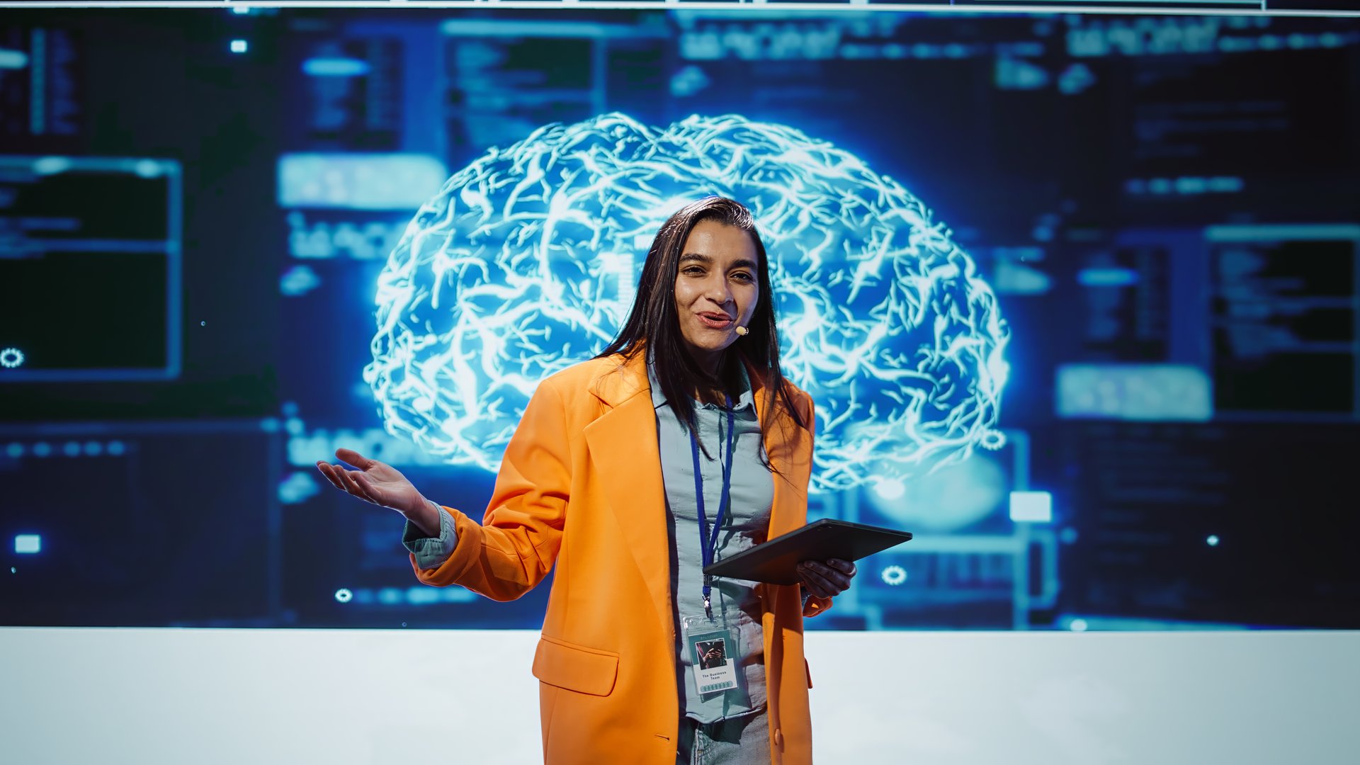 Happy speaker doing presentation at tech conference, explore ways emerging AI technologies can positively enhance companies workforce. Presenter promoting artificial intelligence solutions, camera B