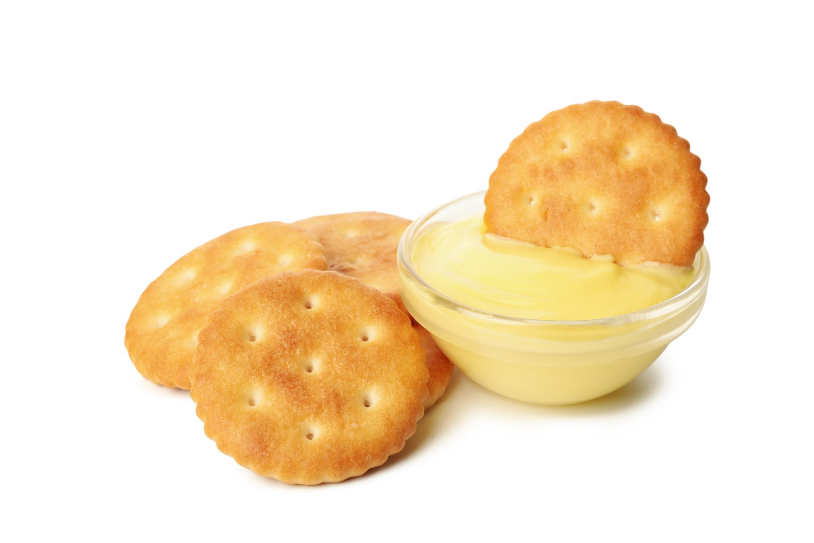 Cracker biscuits and cheese sauce isolated on white background