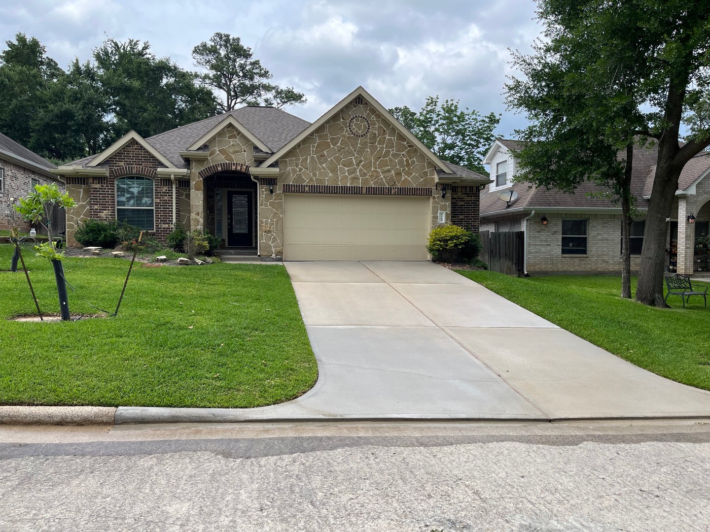 Professional driveway surface cleaning showing clean concrete surface