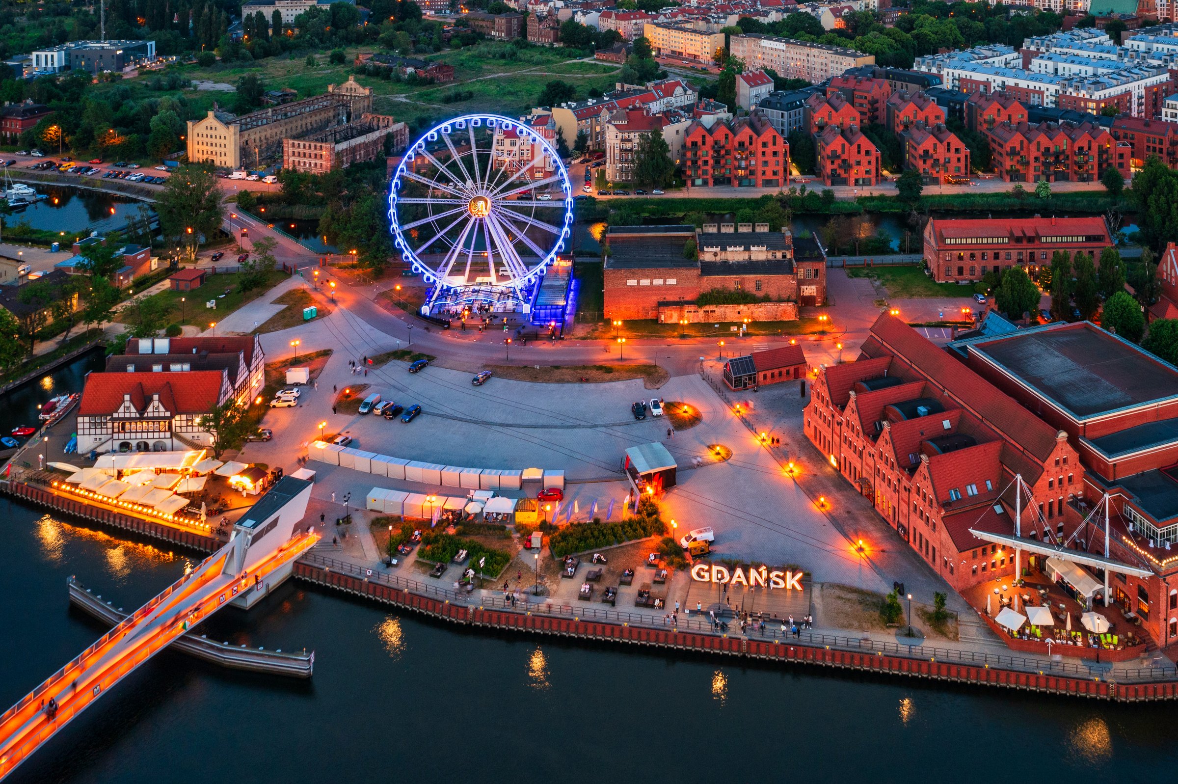 The Main Town of Gdansk with illuminated ferris wheel at sunset, Poland.