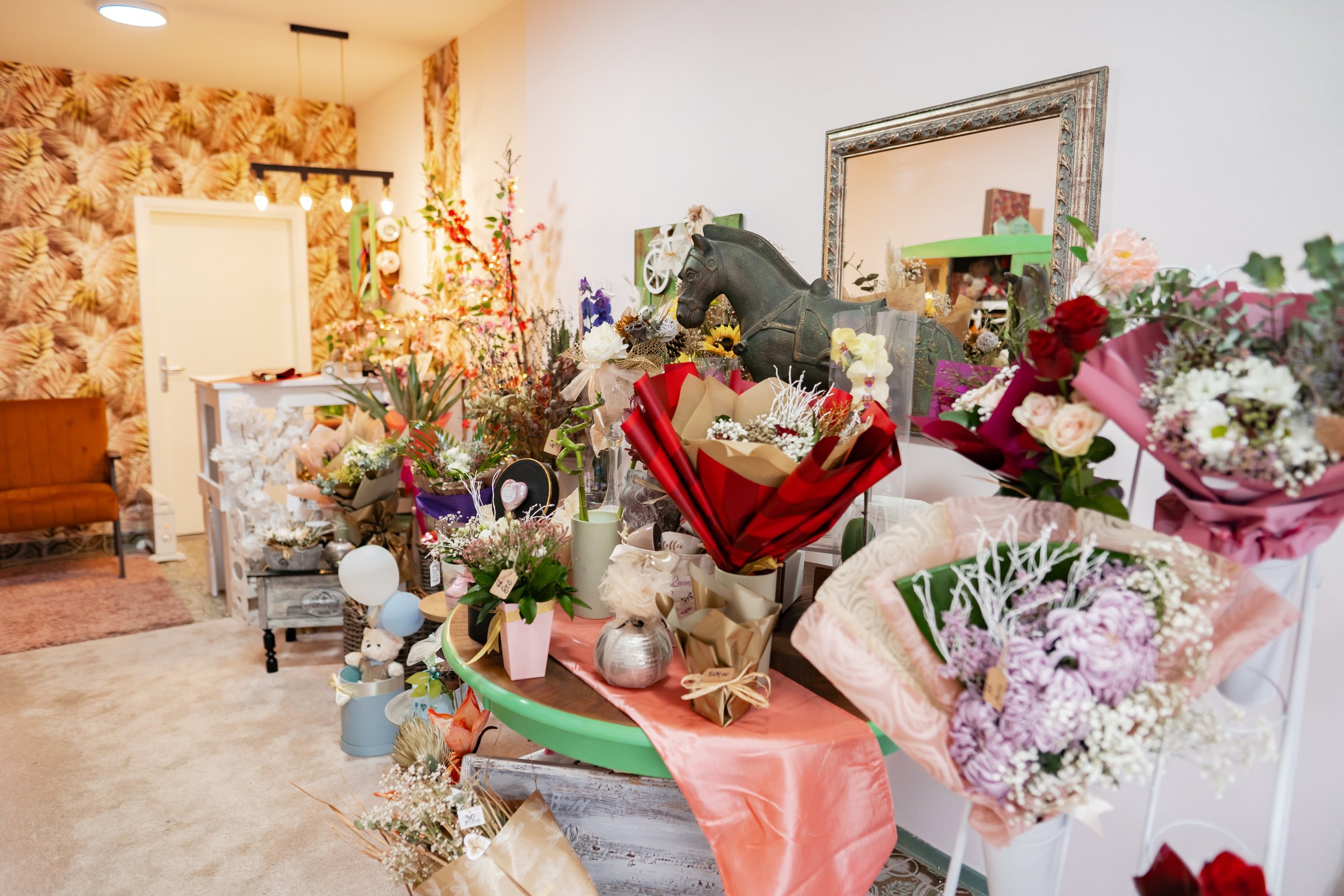 Small business flower shop interior decorated with bouquets and gifts, ready for clients