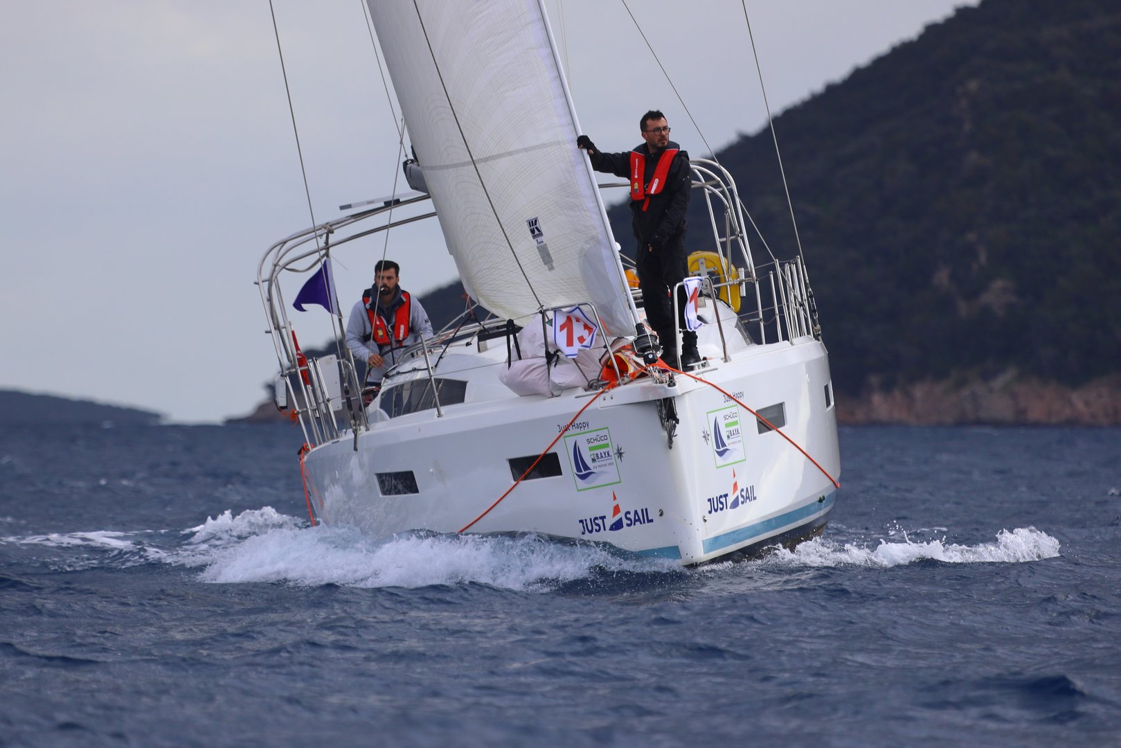 Bodrum,Turkey.   January 11, 2025: Sailboats sail in the blue waters of the Aegean Sea in windy weather on the coast of the famous holiday resort of Bodrum. Boat owners have a pleasant weekend with their sails in the town, where the winter months are warm.