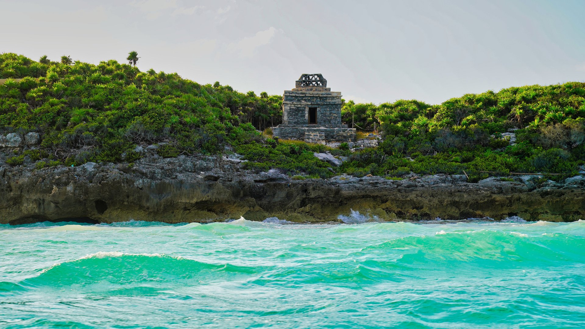 Ancient Mayan watchtowers and look out points overlooking the brilliant blue green Caribbean sea near the late 13th century Mayan ruins of Tulum,Mexico
