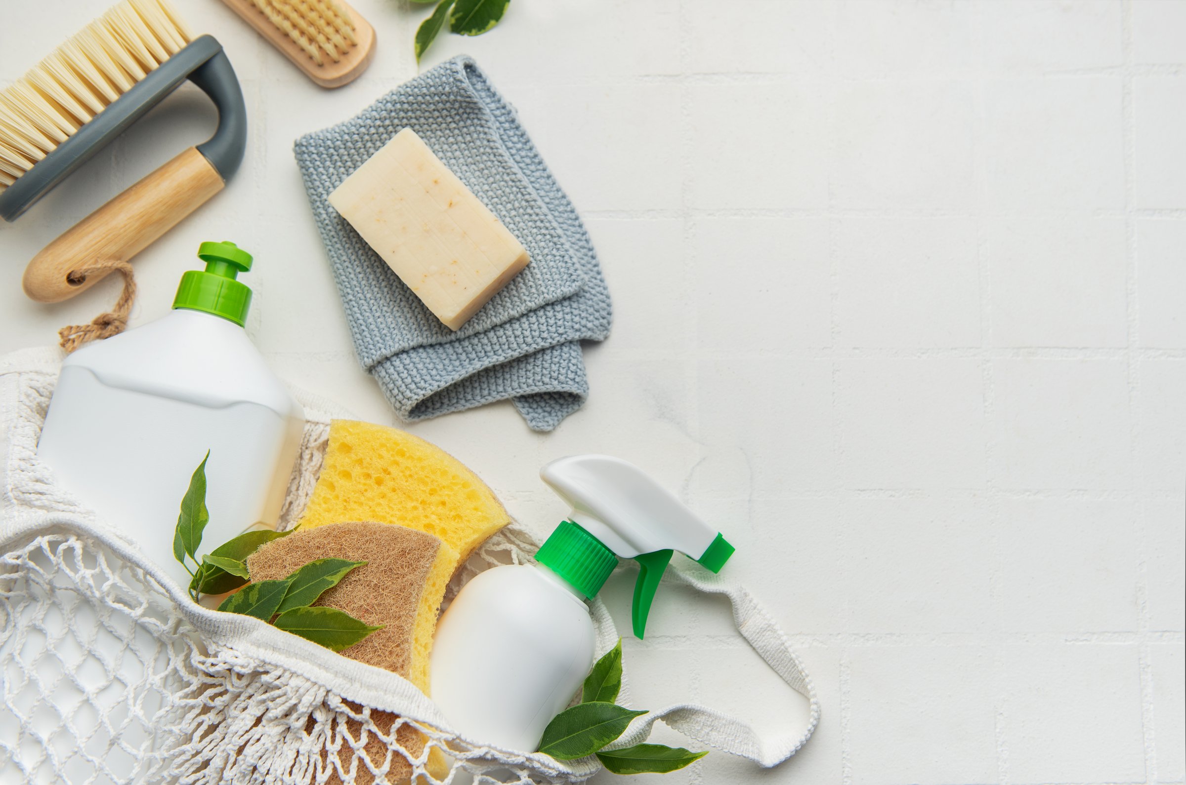 Sustainable cleaning set featuring brushes, sponges, and soap