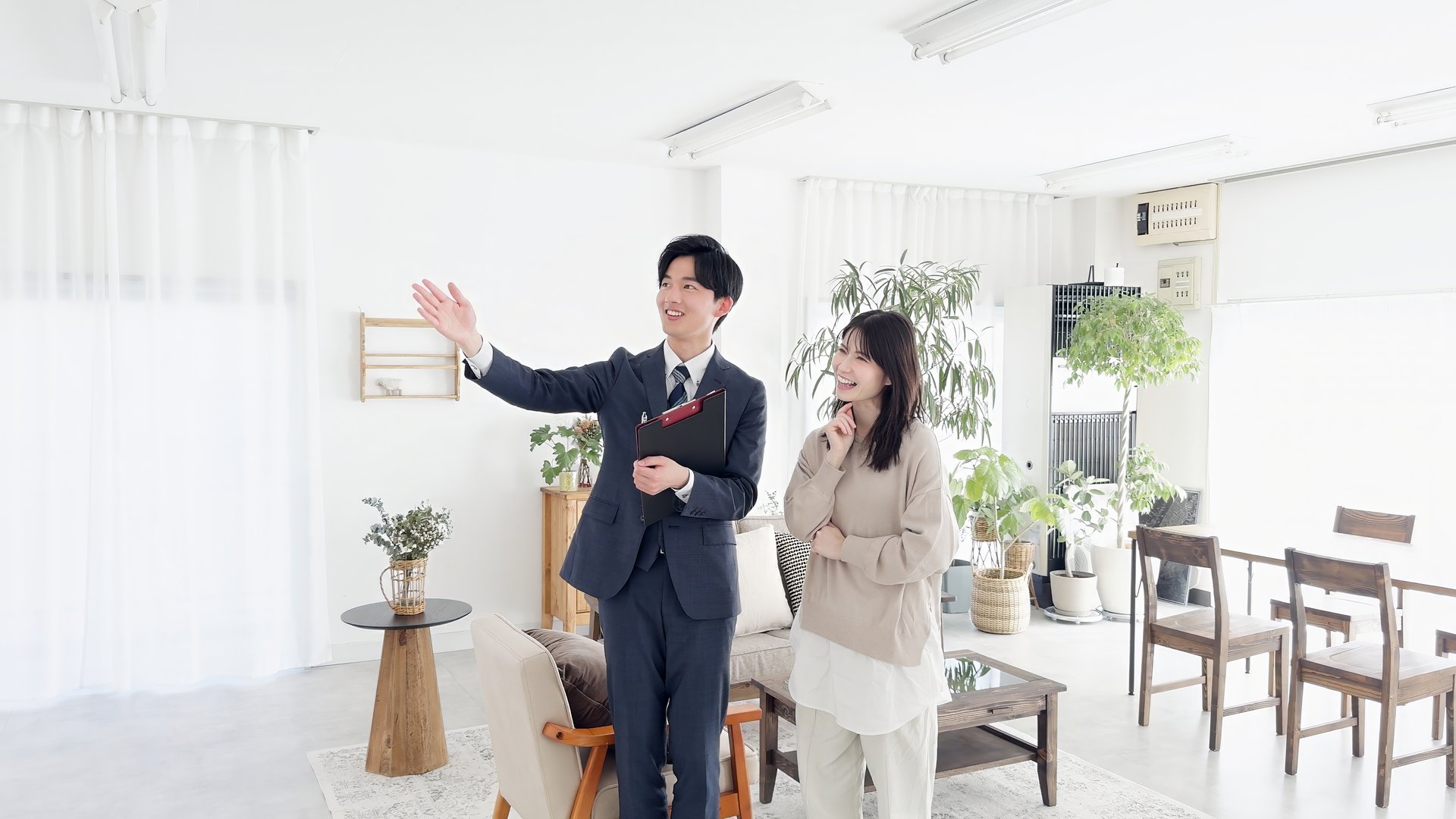 Asian businessman showing the room