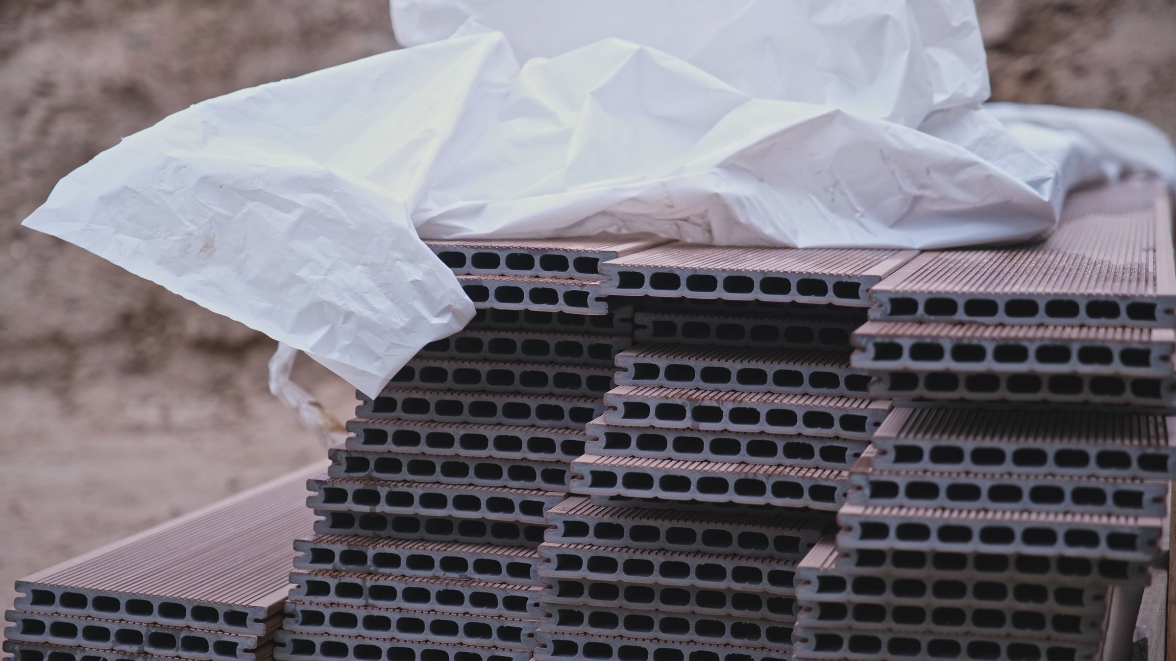 Stack of Composite Planks Prepared for Mounting on Outdoor Terrace Floor