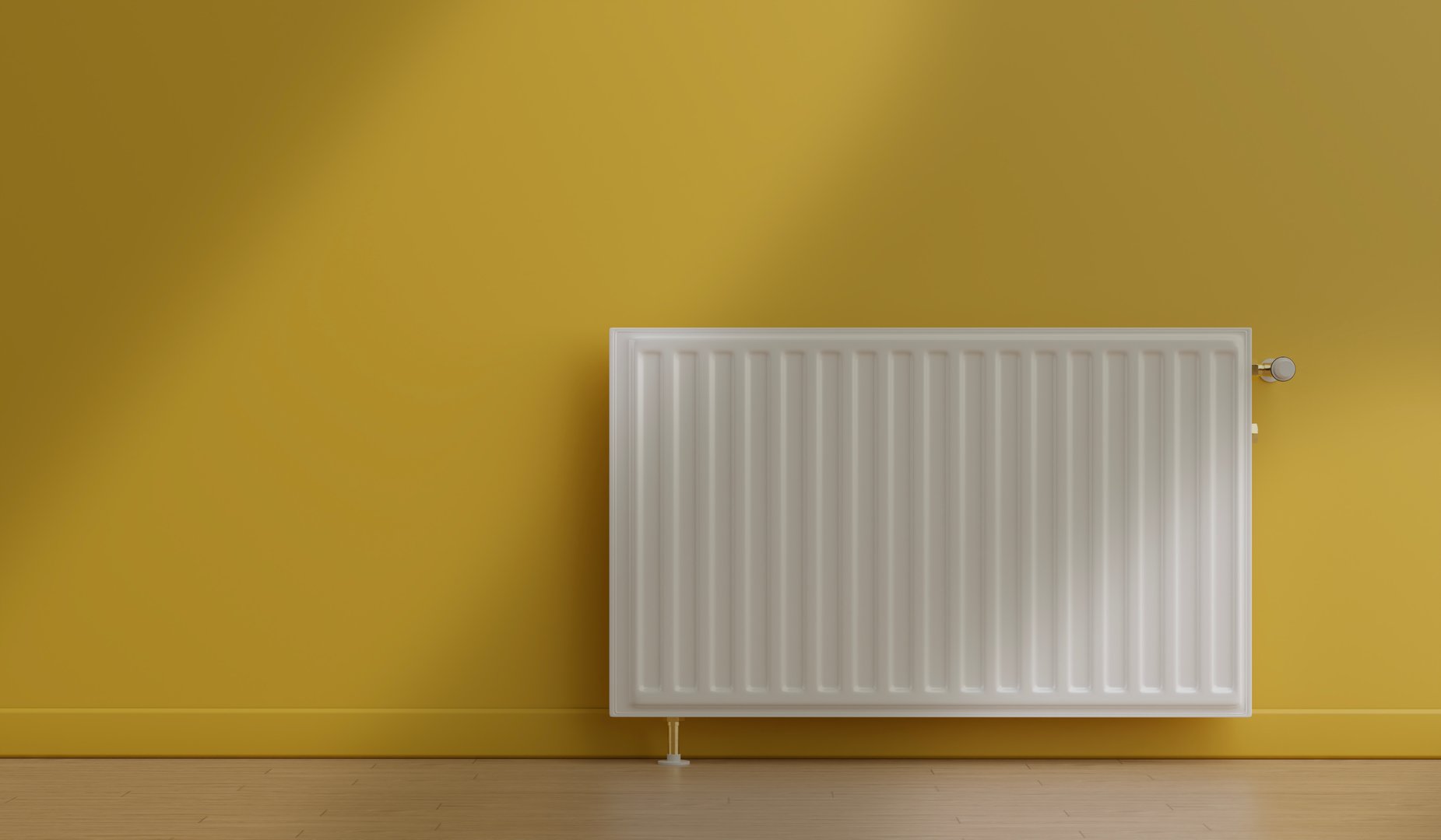 radiator heater in front of yellow wall