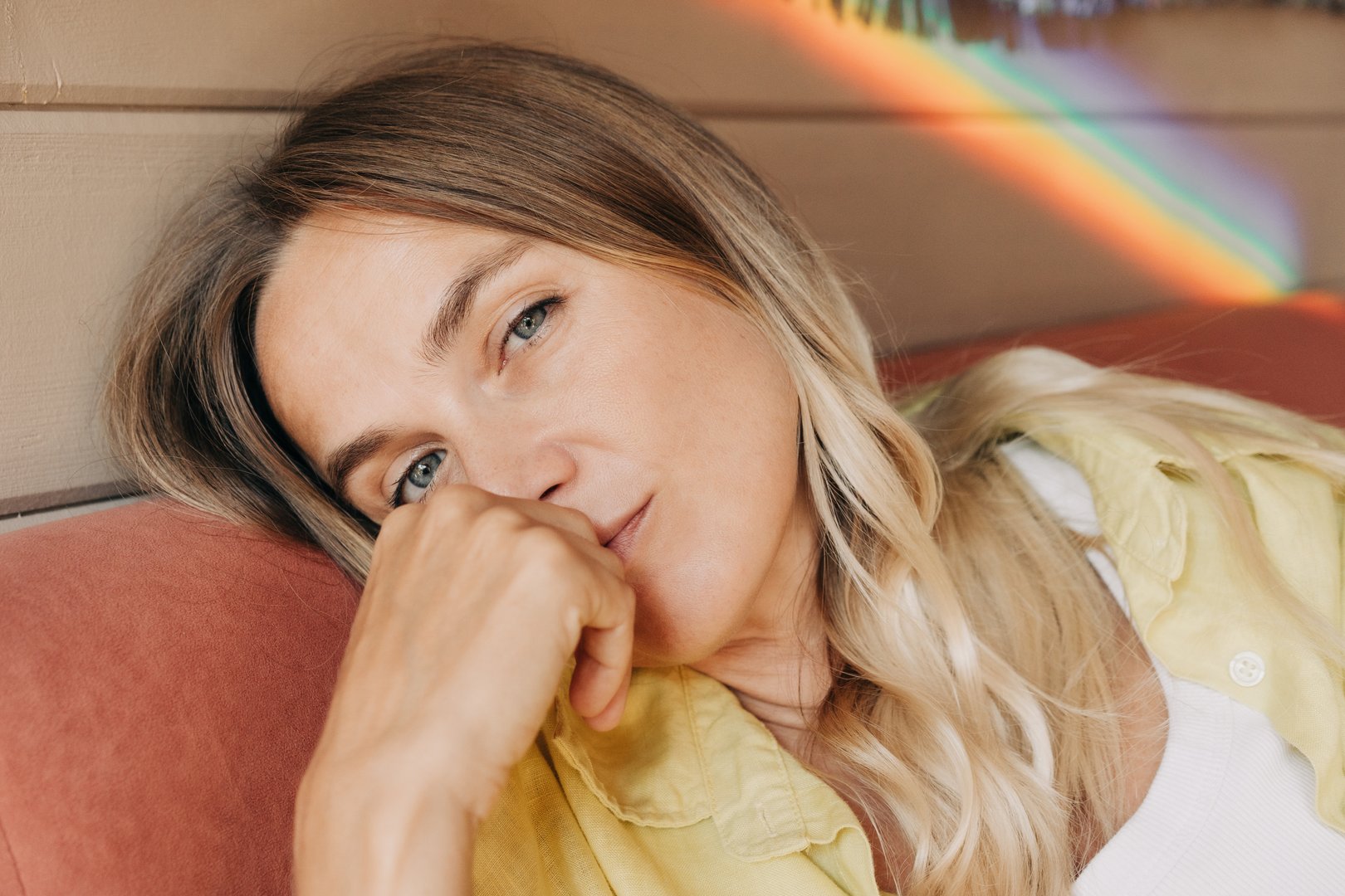 Close-up portrait of a thoughtful, calm forty-year-old woman