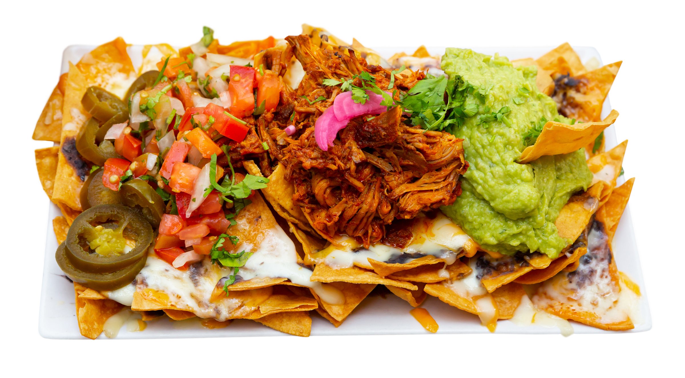 Image of corn chips nachos with homemade guacamole sauce, meat, cheese and vegetables. Isolated over white background