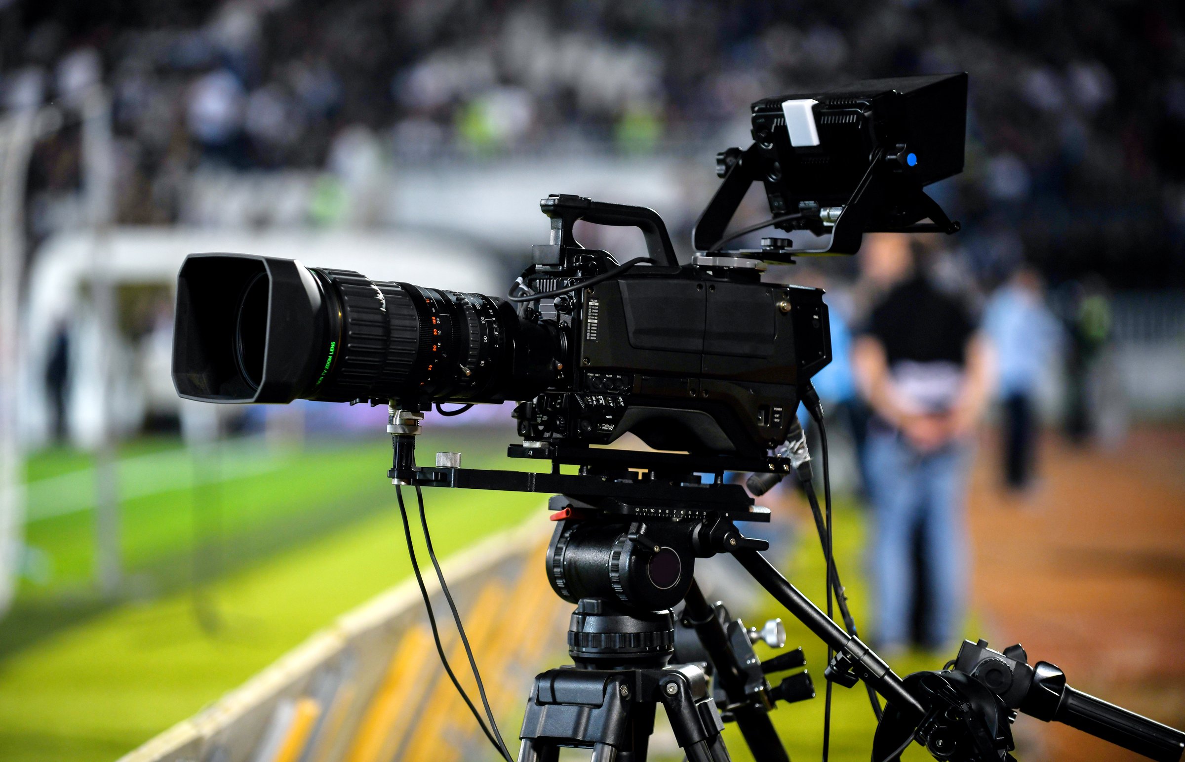 TV camera at the stadium during football match