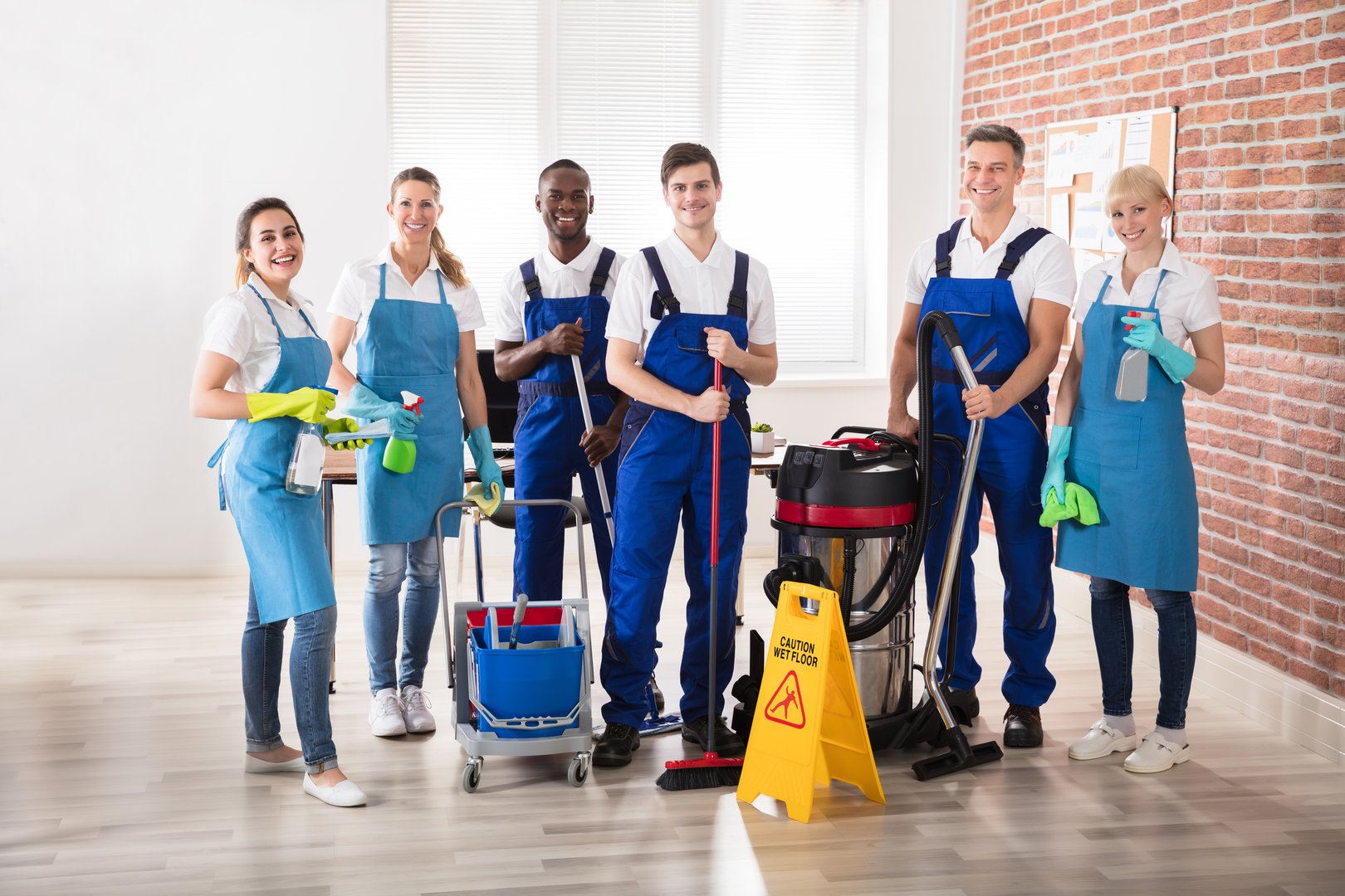 Happy diverse janitors