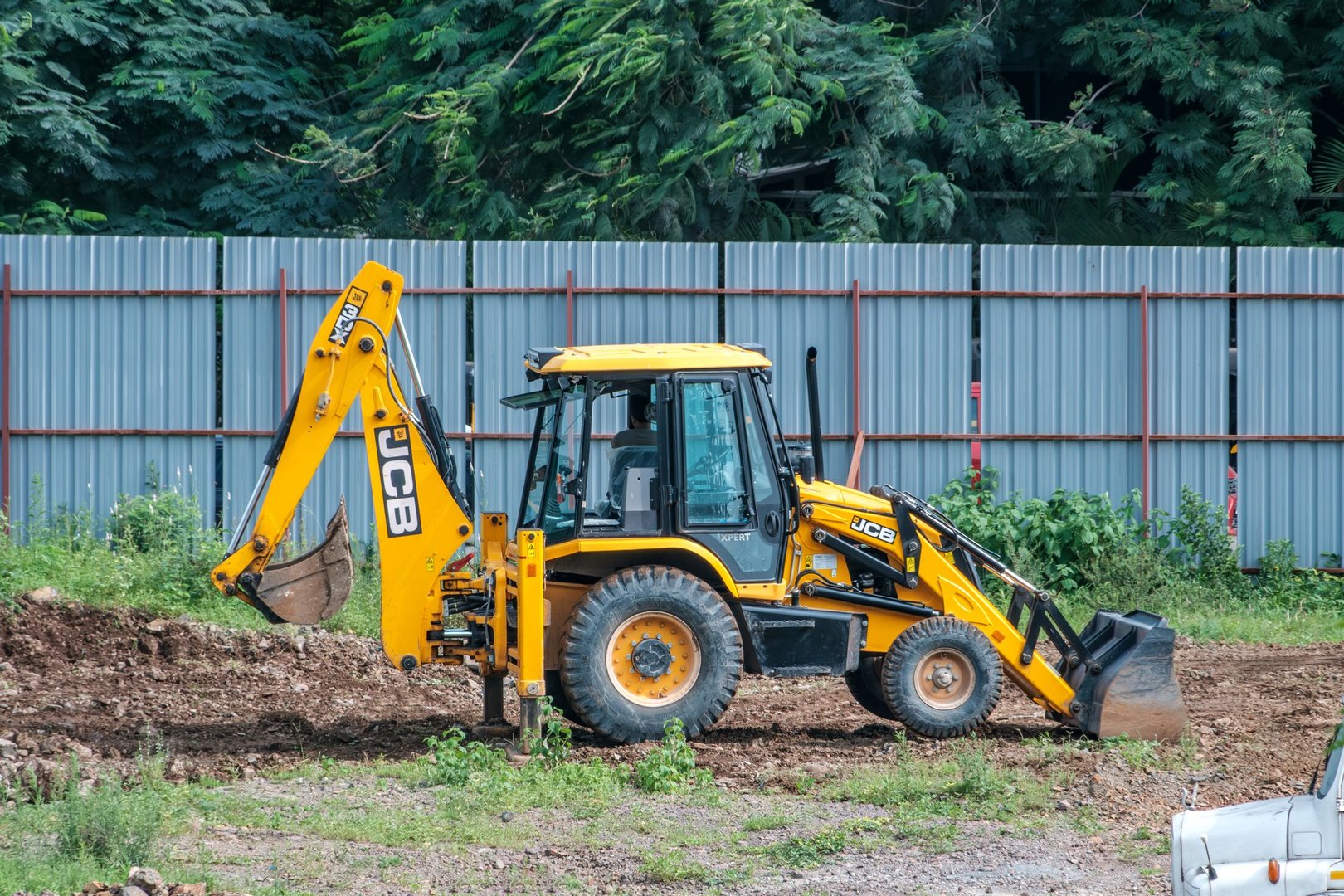 Pune, India - August 06 2024: An earth excavator machine at a construction site at Pune India.