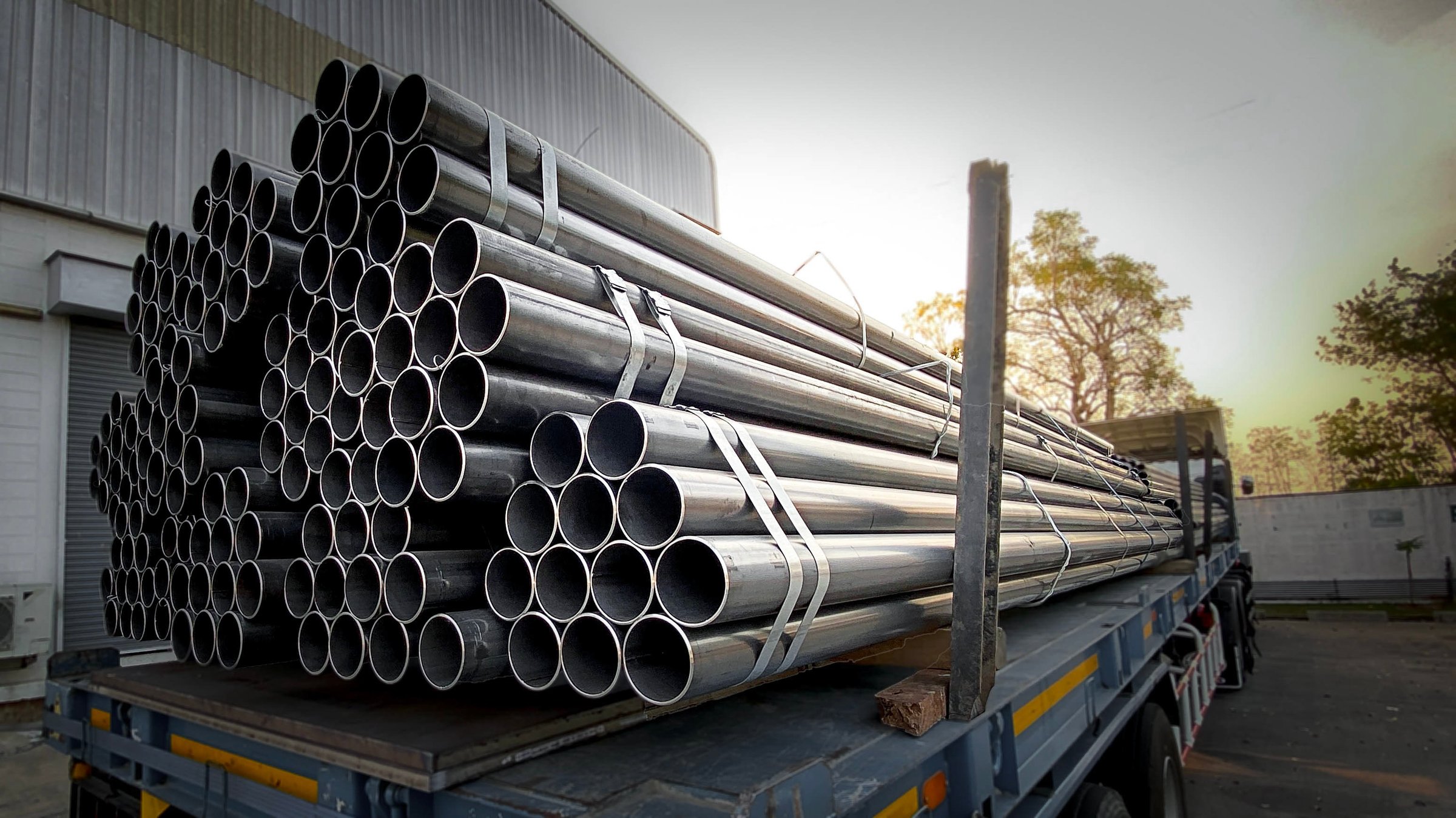 Steel pipes are placed in factory, steel pipe for fabrication,Stacked together of steel tube, close-up.steel pipes in  in warehouses awaiting delivery.at thailand
