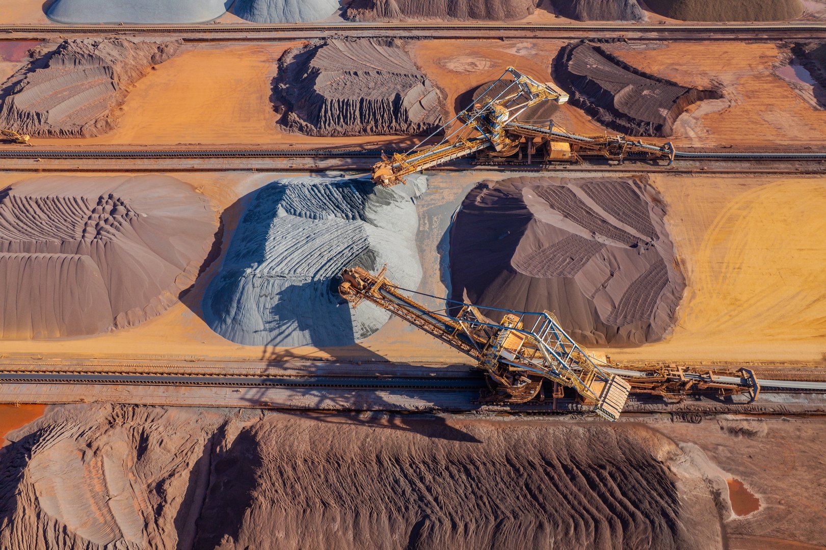 Overhead view of large machinery at work in a metal mine
