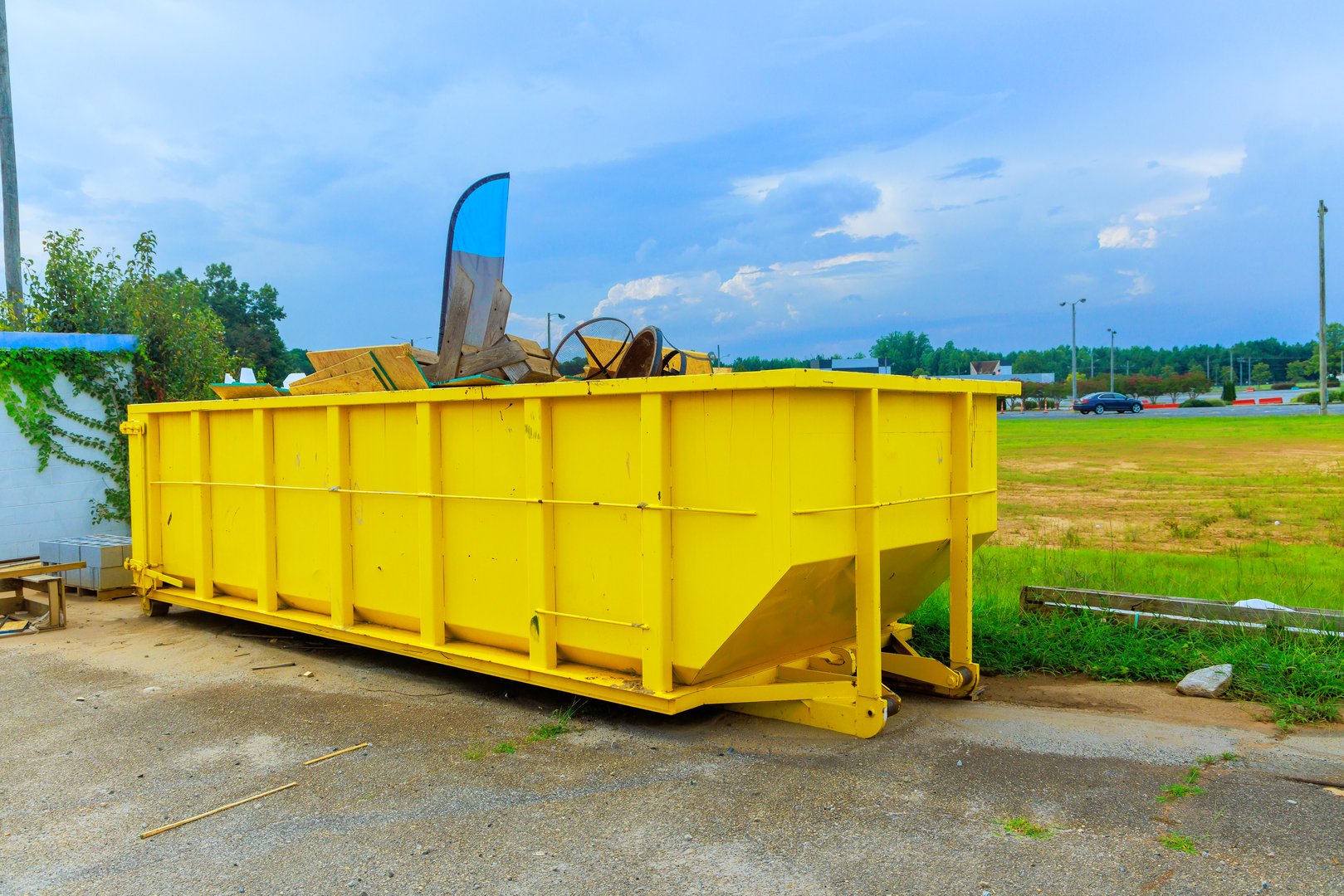 Construction site dumpsters of metal containers for collection of waste during construction