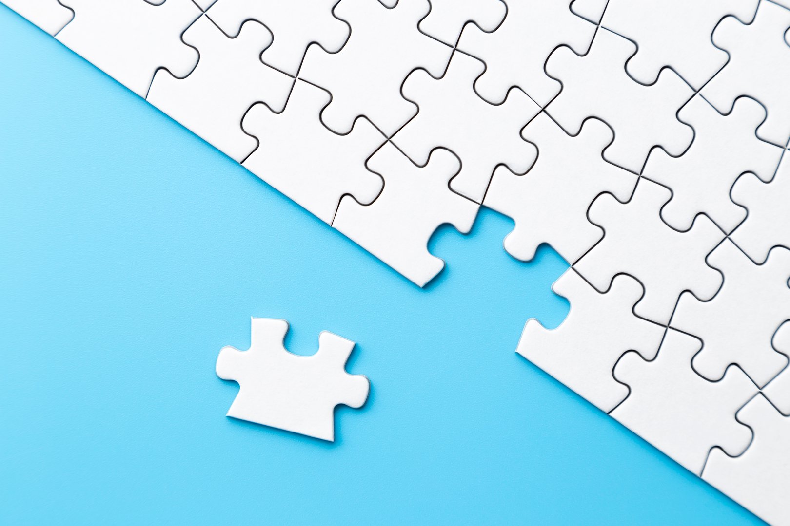 Plain jigsaw puzzle on a blue background