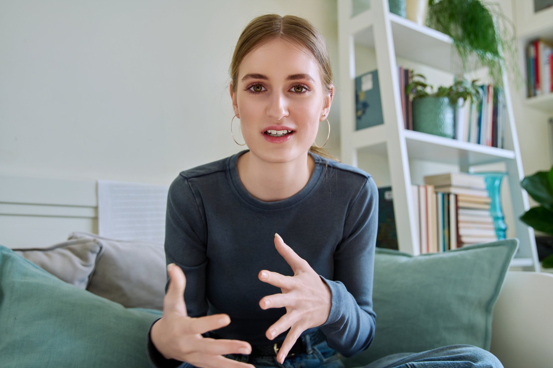 Web camera view of teenage girl 16,17,18 years old talking looking in camera, online meeting, internet video call chat conference. Attractive teenager female blogger vlogger recording video in home