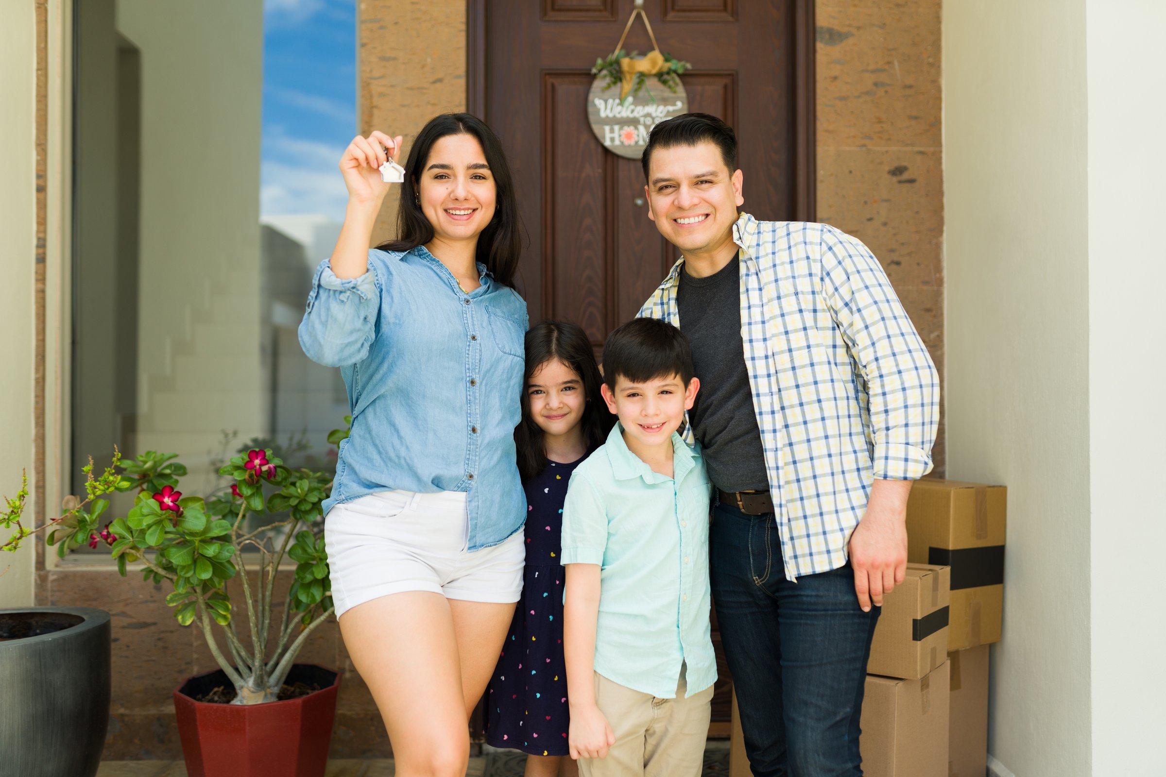 Hispanic family with new house keys