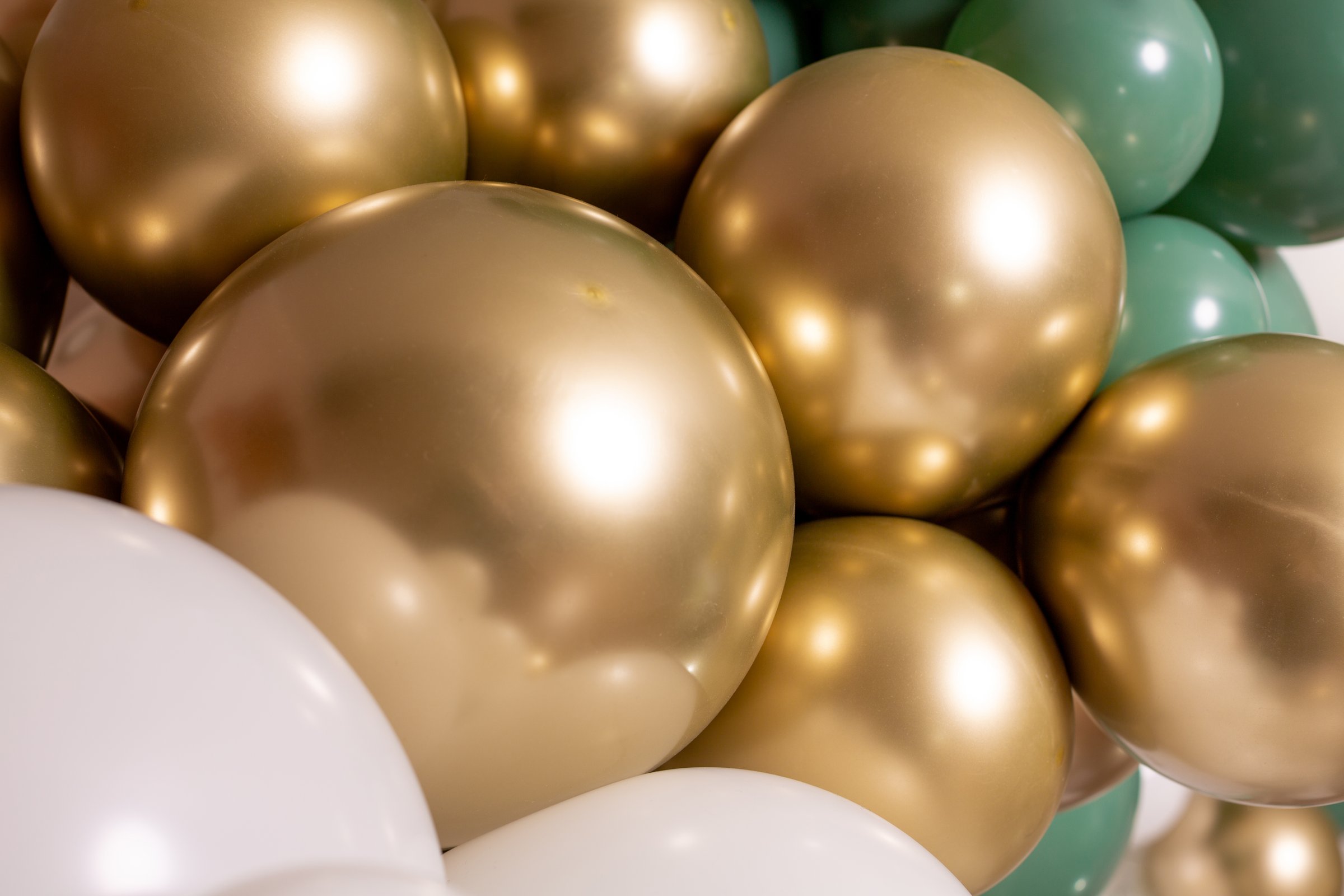 Gold green white balloon decorations