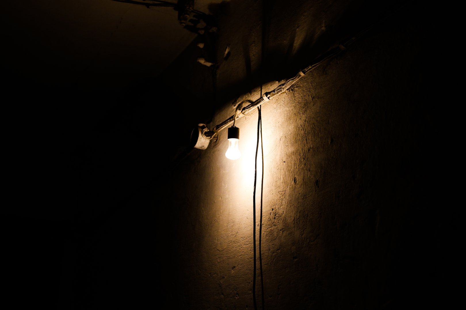 The lamp illuminates a dark room