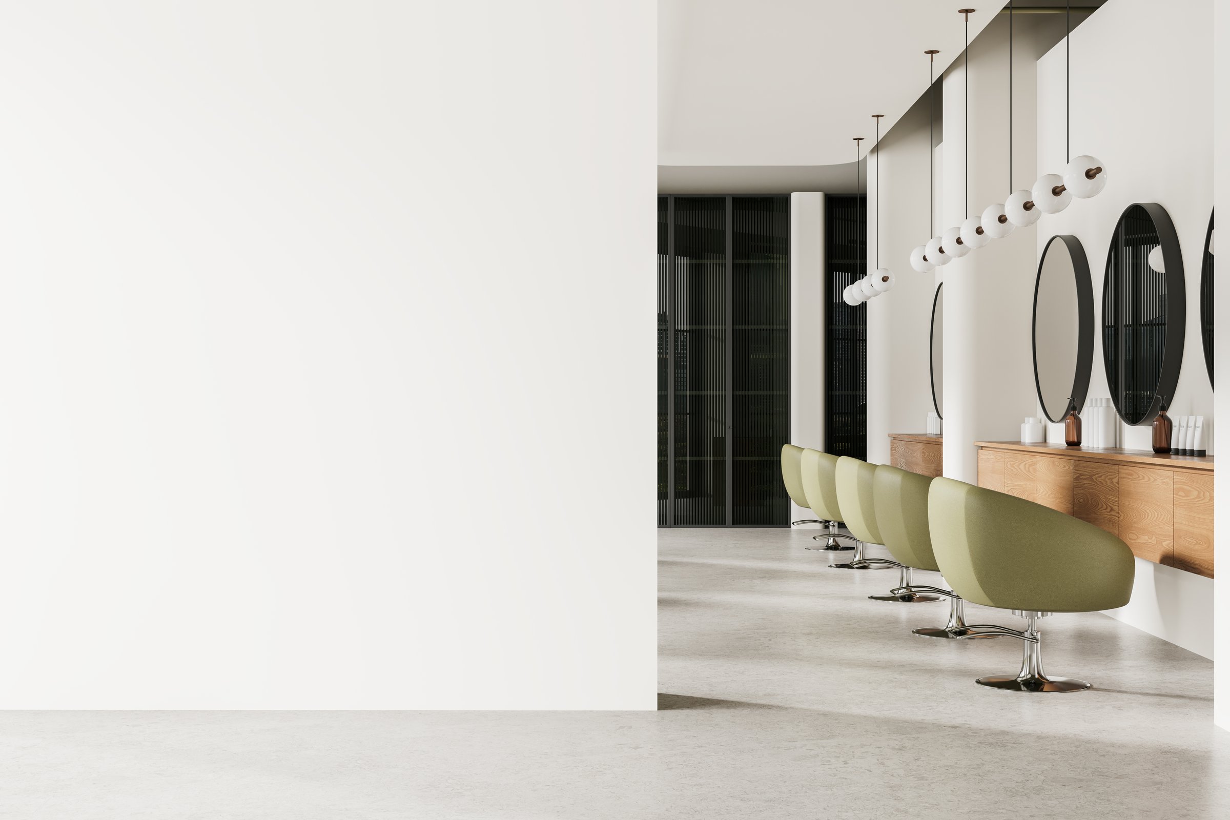 Interior of modern hairdresser studio and beauty salon with white walls, concrete floor, row of green mint chairs with round mirrors in front of them. Copy space wall on the left. 3d rendering