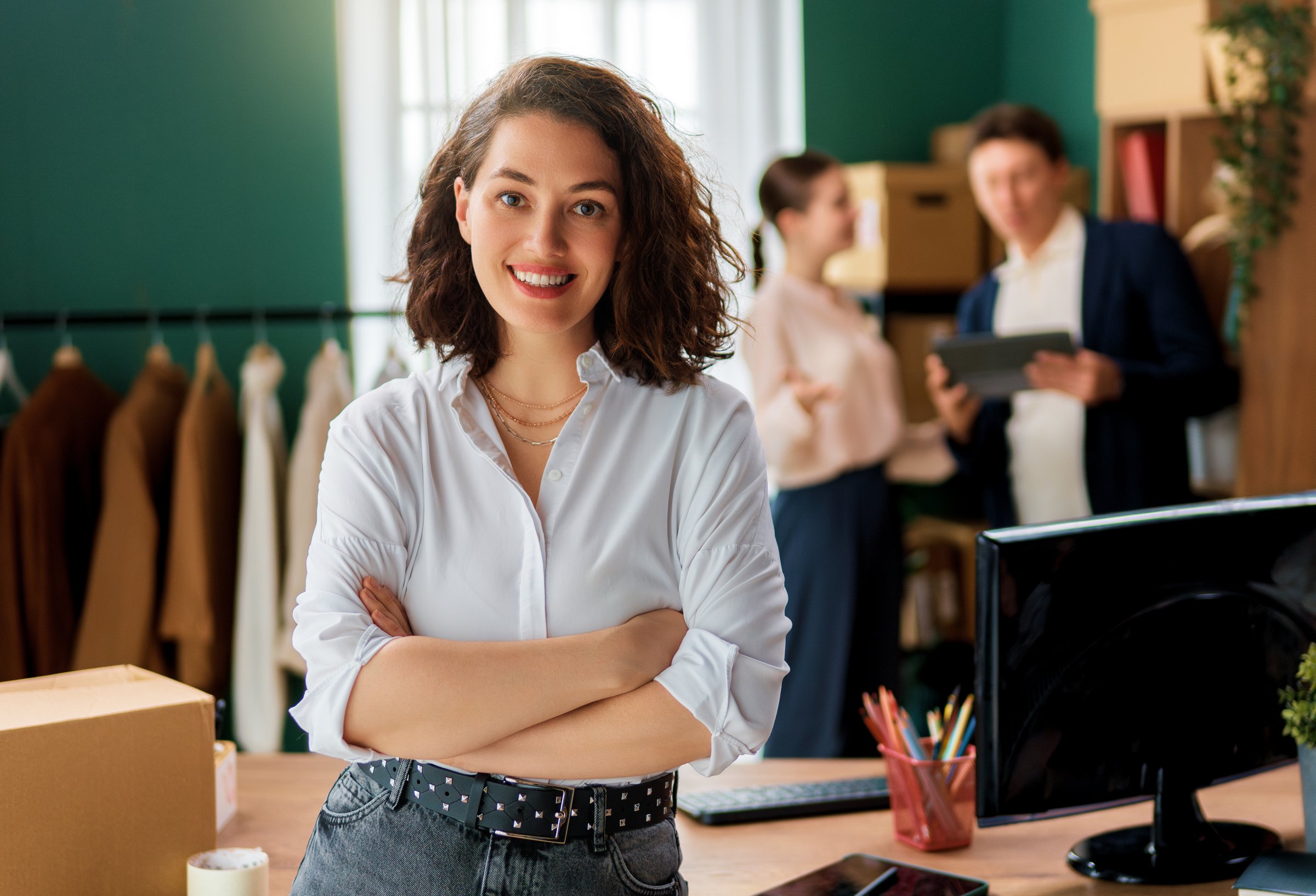 Young people fashion designers are working in studio.