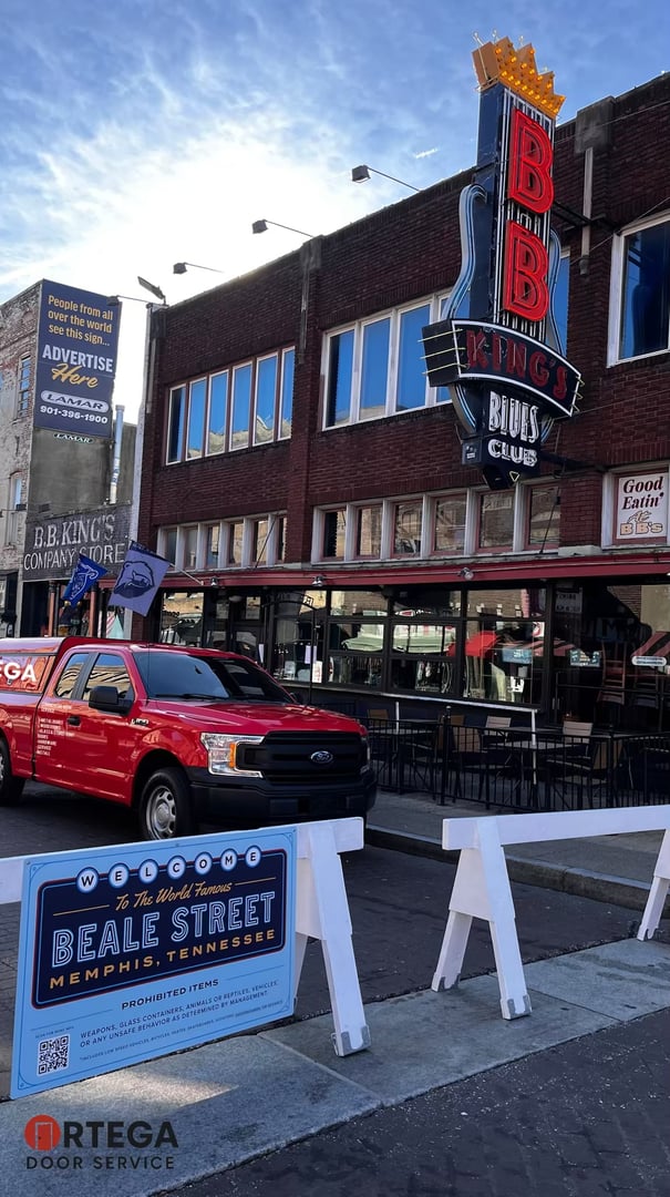 Ortega Door company truck parked at a commercial job site in Memphis