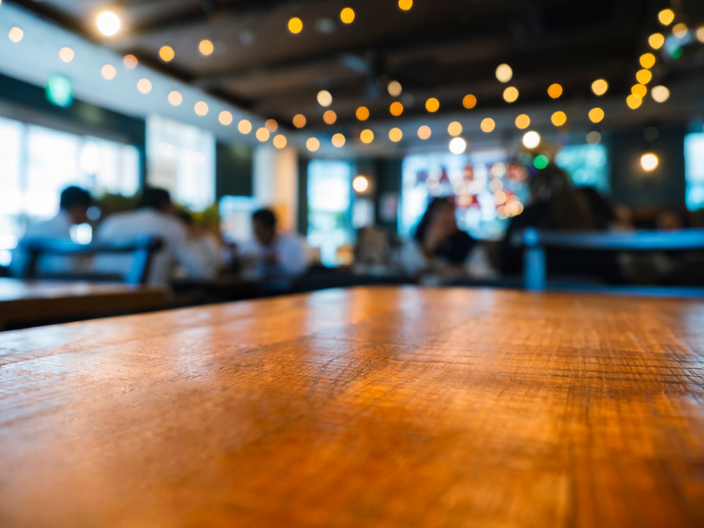 Table top wooden counter Bar with people interior restaurant Blur background