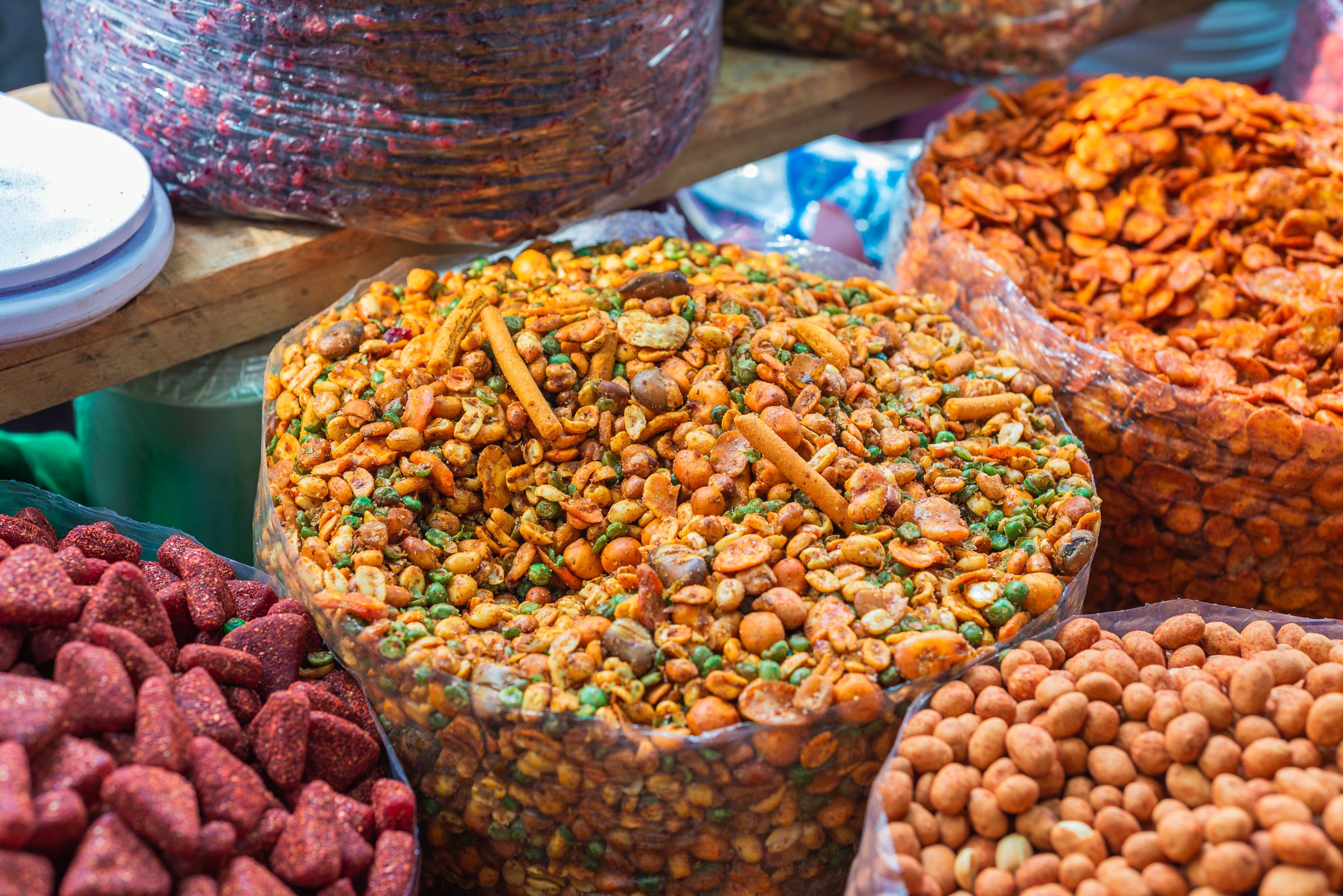 Mixture of nuts and dried fruits with chili. Snack for sale in a market in Mexico.