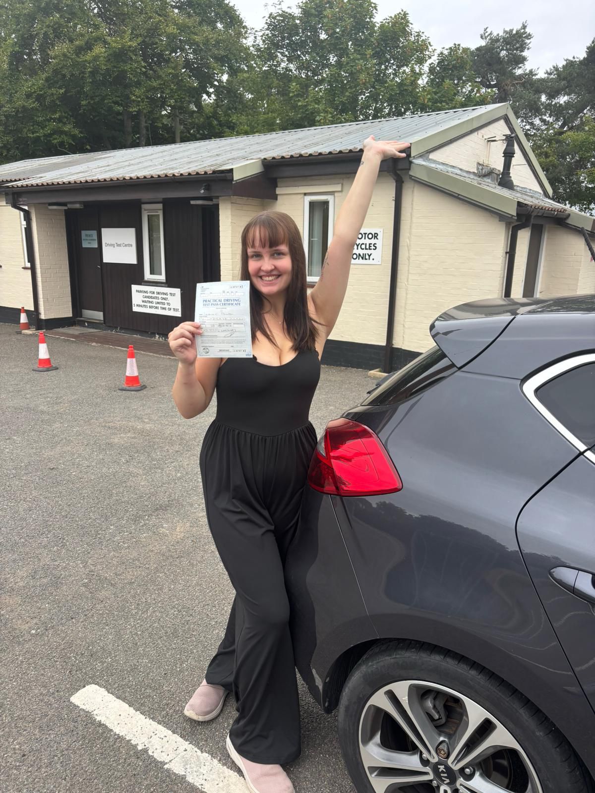 Successful driving test student with pass certificate