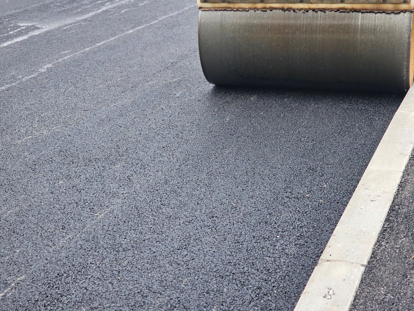 Roadworks, Road construction. Paving roller on roadworks at construction site, paving works. High quality photo