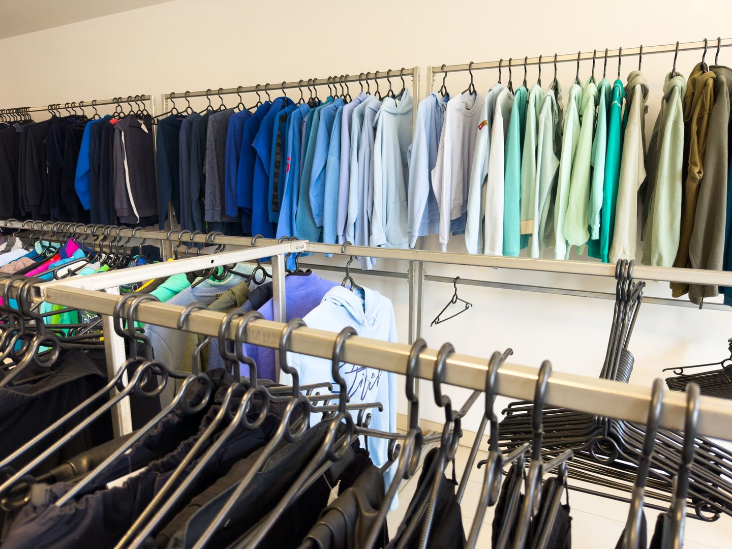 Close-Up of Clothing in a Second-Hand Store – Sustainable Fashion and Thrift Shopping