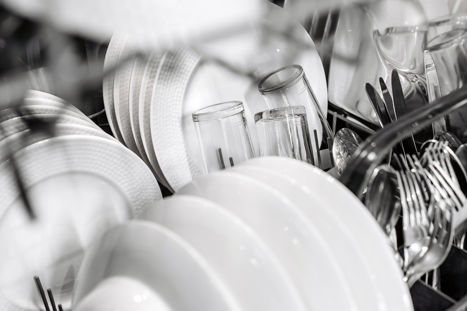 A modern dishwasher demonstrates an organized interior space