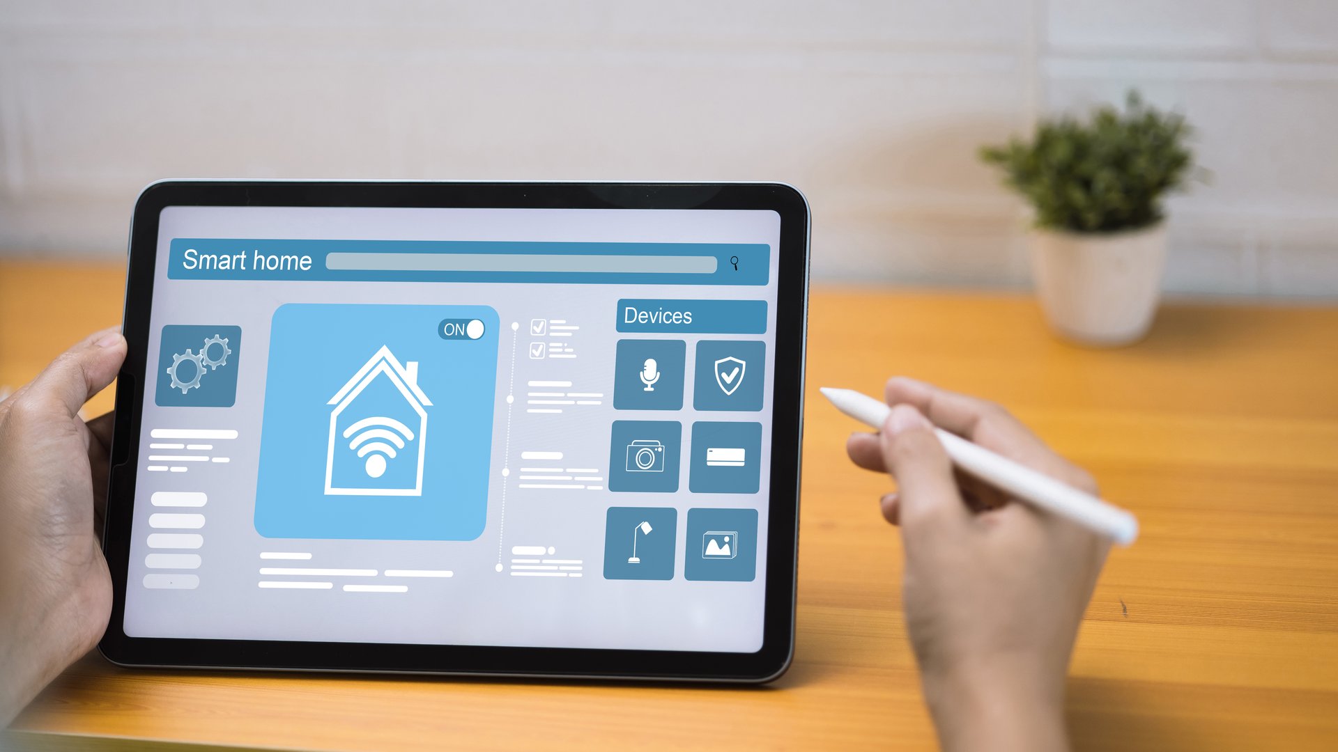 Smart home control interface on tablet with stylus in hand, showing IoT technology, smart devices, automation system, and modern home security solutions.
