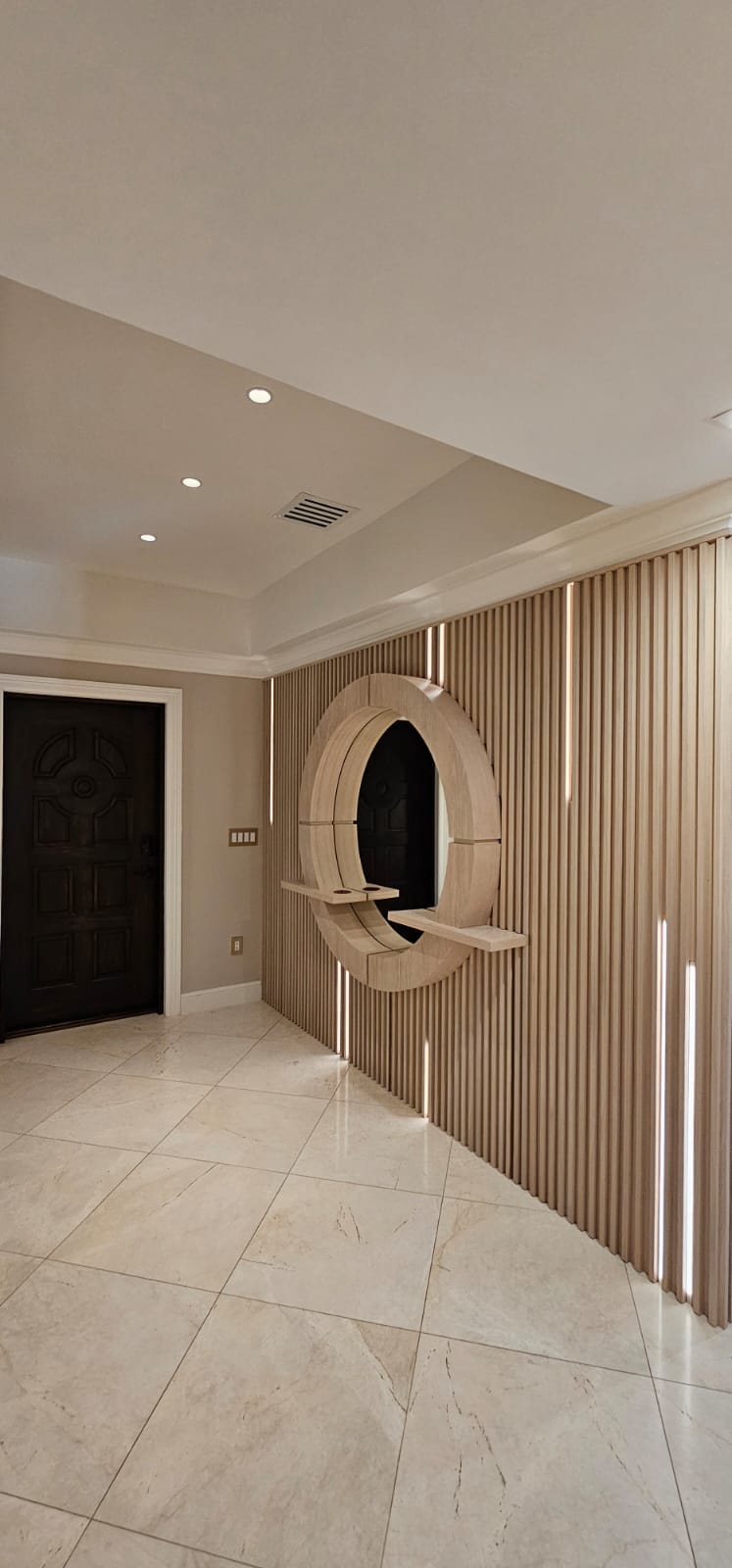 Modern design project featuring custom wood finishing and decorative wall panels