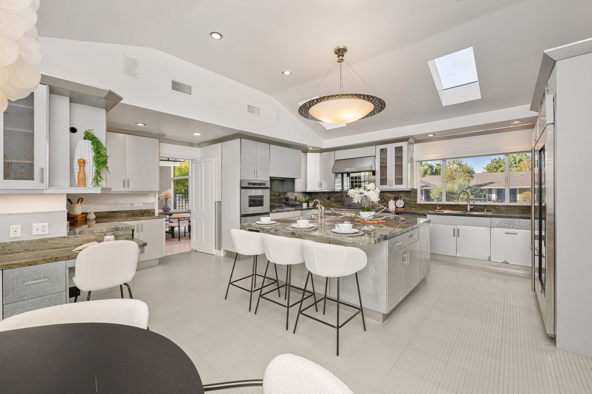Modern kitchen with white cabinetry and island