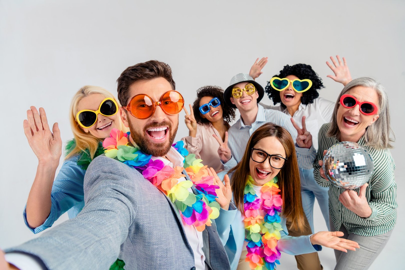 A cheerful team of professionals celebrating in the workplace, reflecting fun, diversity, teamwork, and a festive atmosphere.